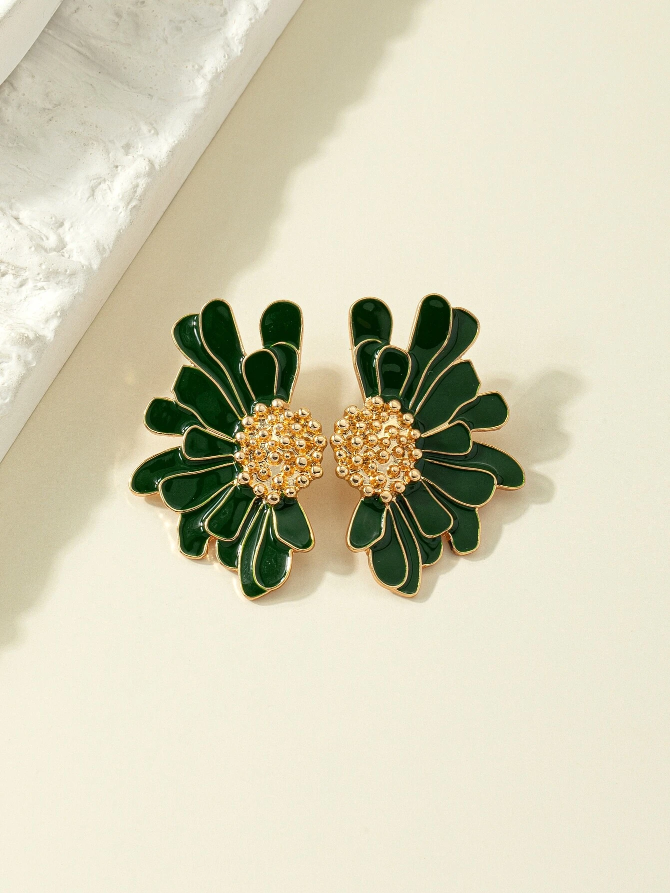 Green flower design stud earrings, featuring delicate floral patterns in a stylish and understated stud format.