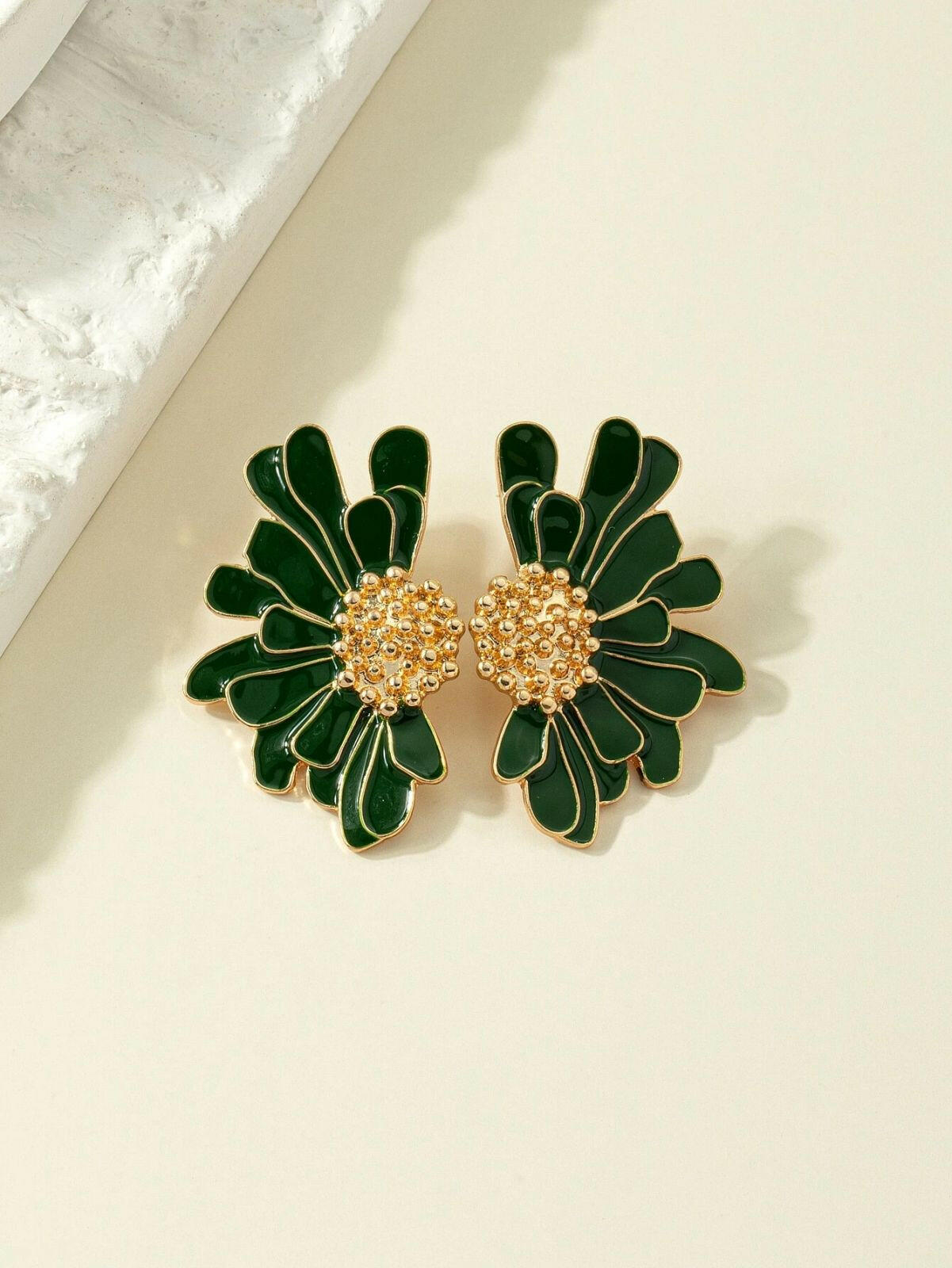 Green flower design stud earrings, featuring delicate floral patterns in a stylish and understated stud format.