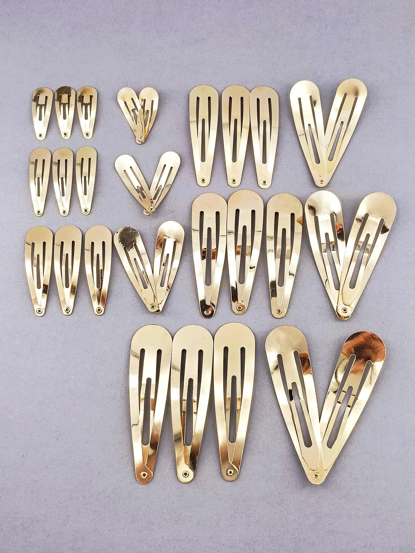 A set of 30 minimalist snap clips, offering sleek and simple hair accessories for versatile styling.