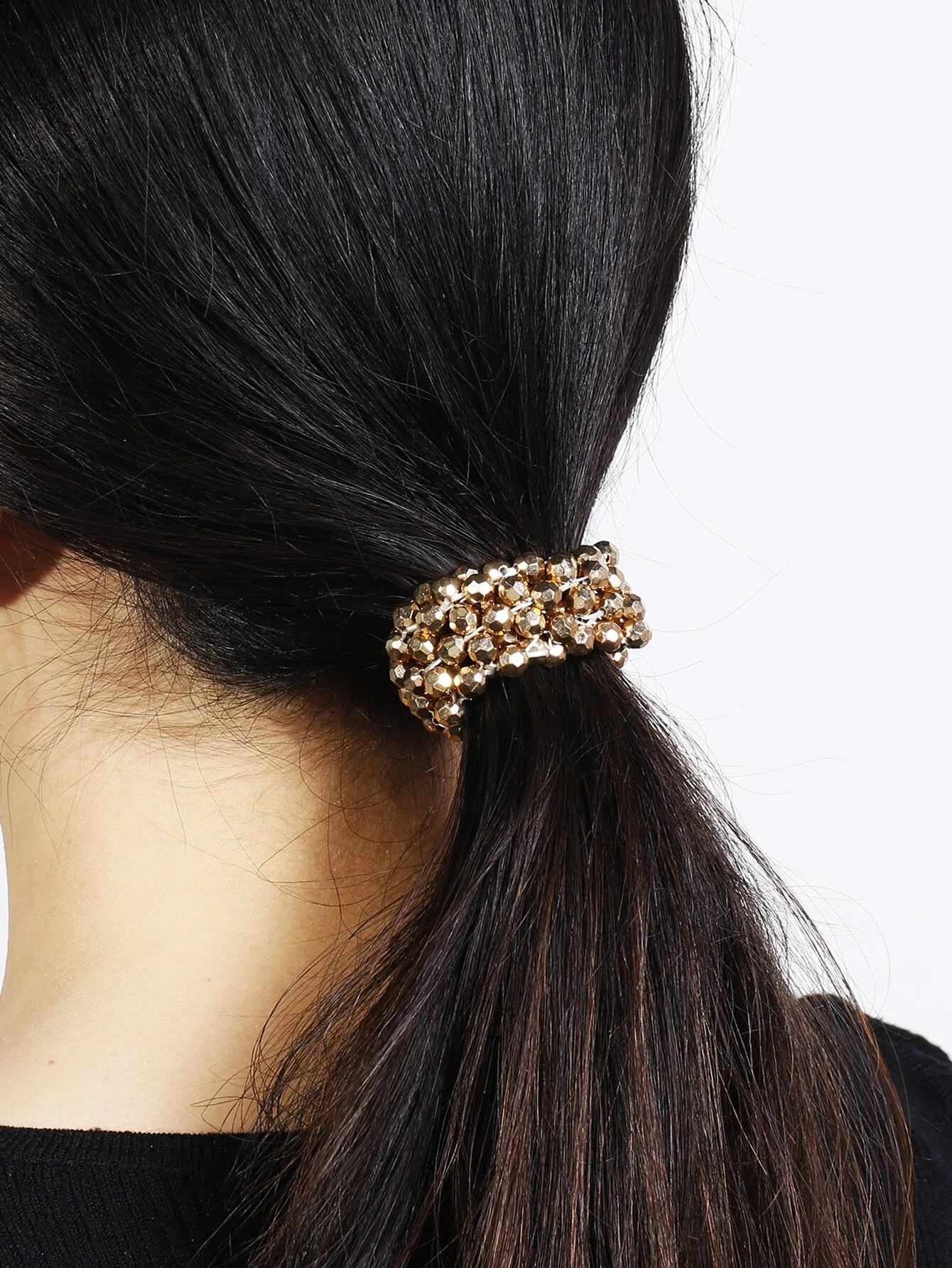 A hair tie adorned with beads, providing a unique and stylish way to secure and adorn your hair.
