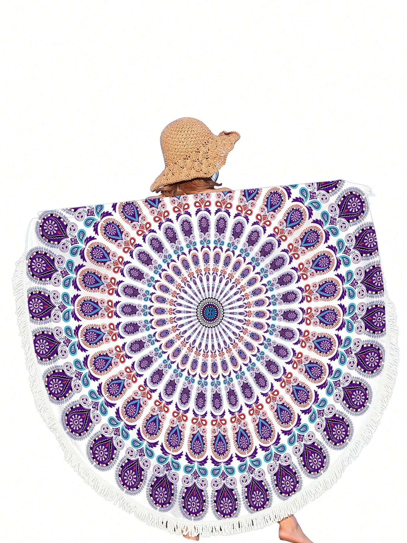 A beach towel featuring a purple mandala pattern and fringe trim. The towel showcases an intricate mandala design in shades of purple, with decorative fringe trim along the edges. This towel is both stylish and functional, perfect for beach outings or outdoor relaxation. The purple mandala pattern and fringe trim add a touch of bohemian elegance to the towel.