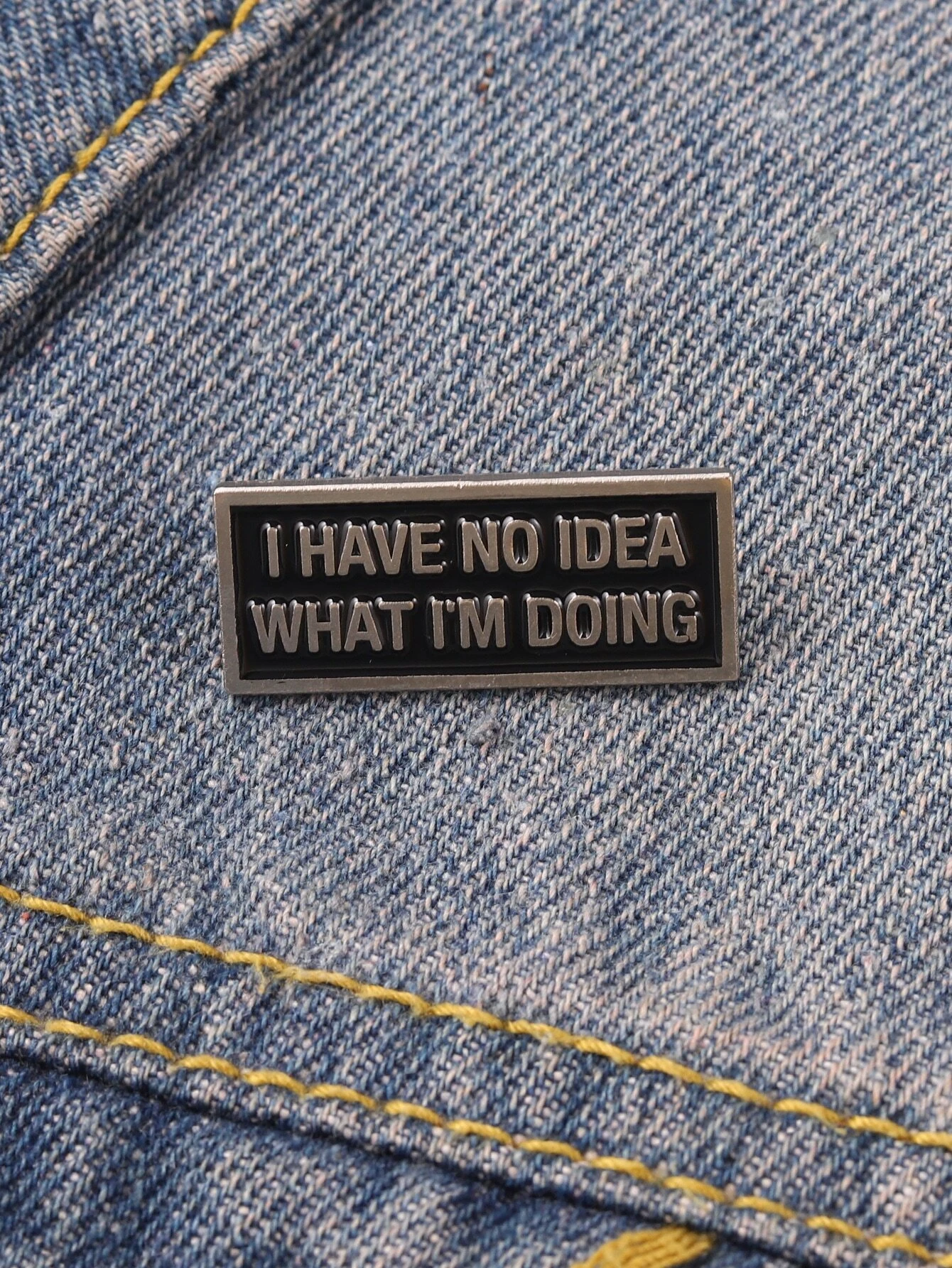 Brooch featuring a captivating slogan graphic, allowing you to convey a message or sentiment in a stylish and eye-catching accessory.