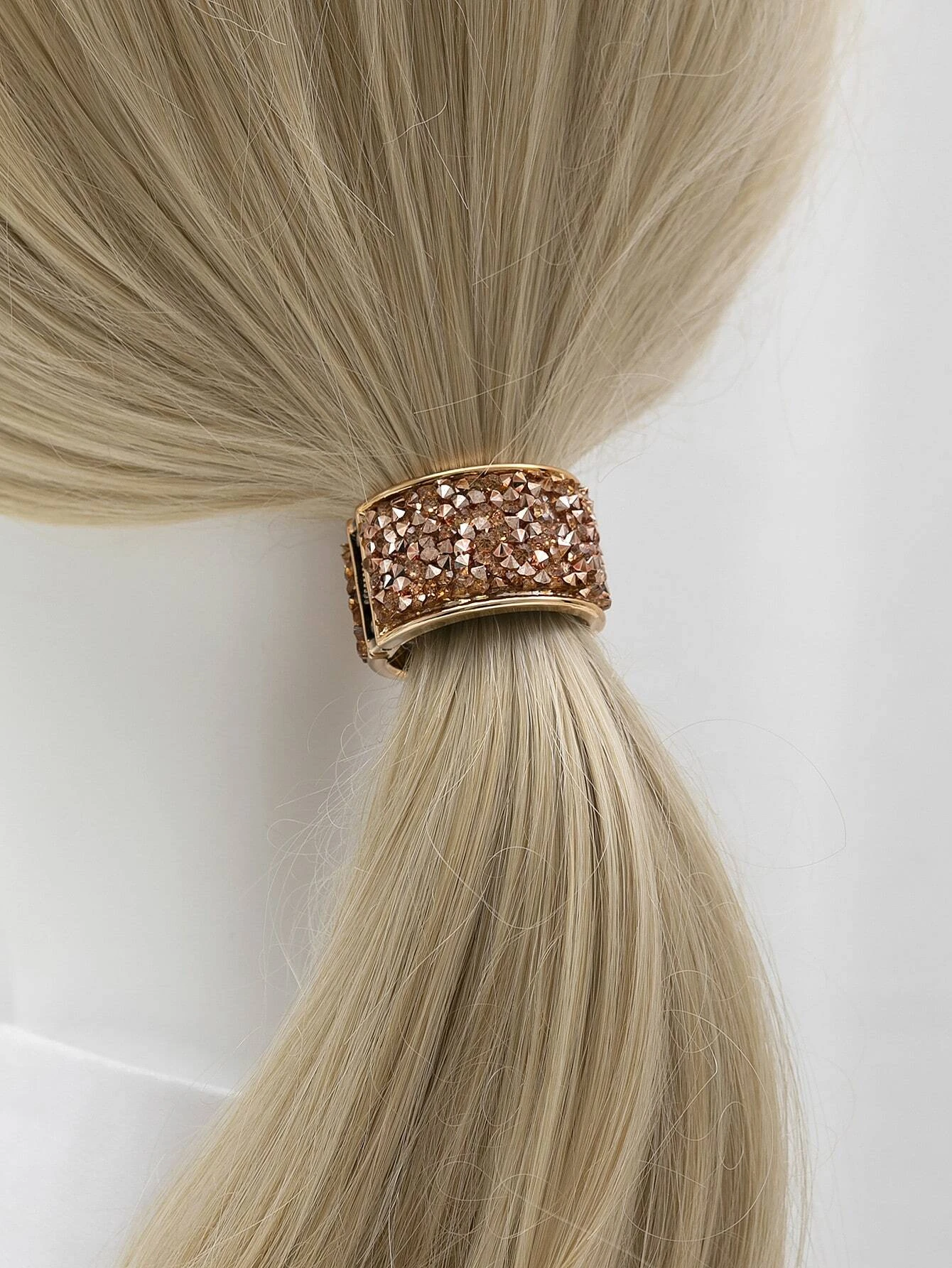 Two hair ties embellished with dazzling rhinestone decorations, perfect for adding a touch of sparkle and style to your hair.