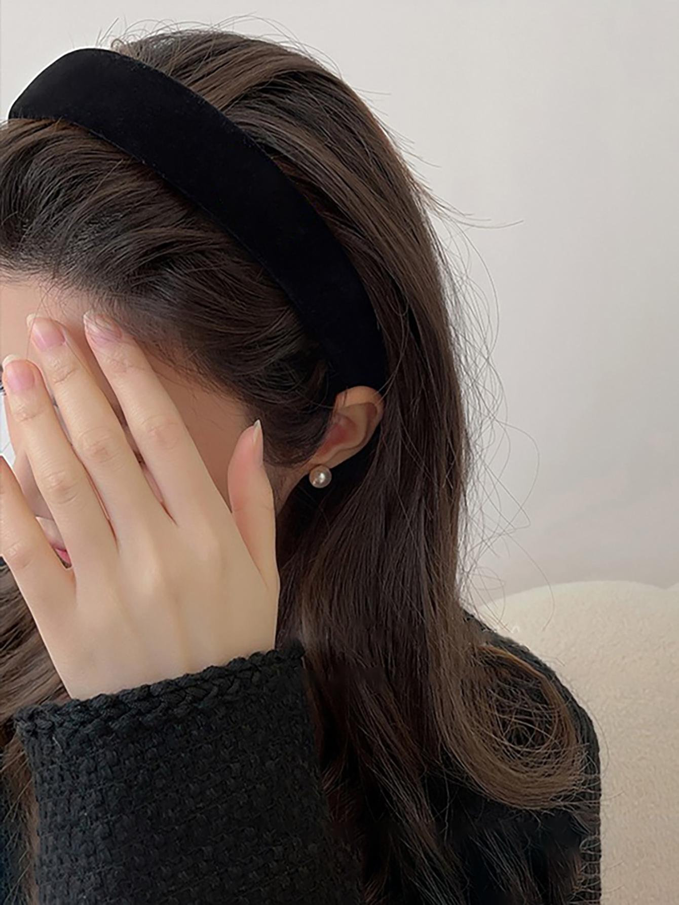 A high crown sponge headband in black velvet, providing a stylish and comfortable accessory to elevate your hair look.