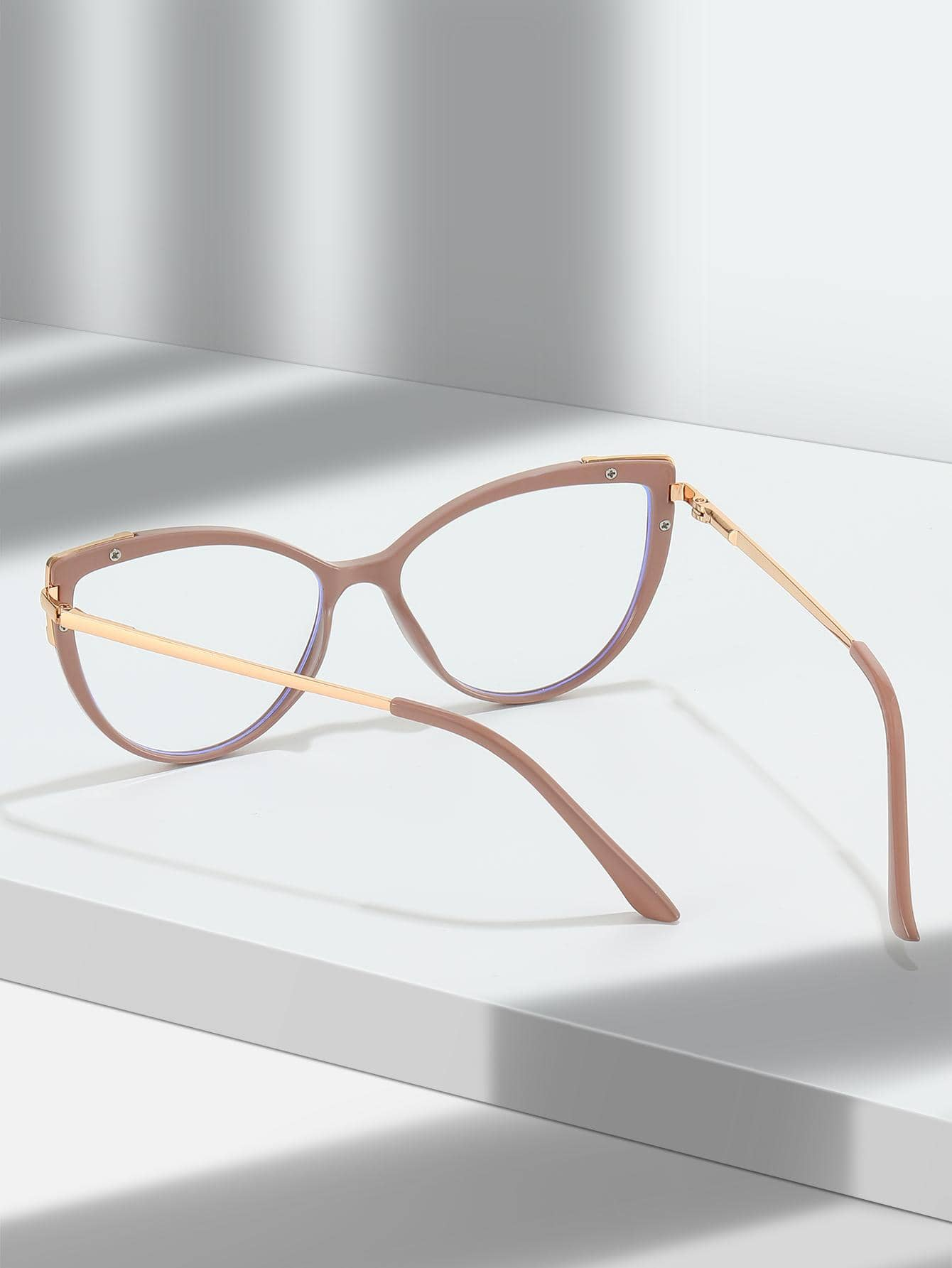 These Dusty Pink Cat Eye Anti-Blue Light Eyeglasses protect your eyes from the harm caused by blue-light emissions, such as digital eye strain, headaches, and blurry vision. The stylish cat-eye frame adds an extra touch of sophistication to your look.