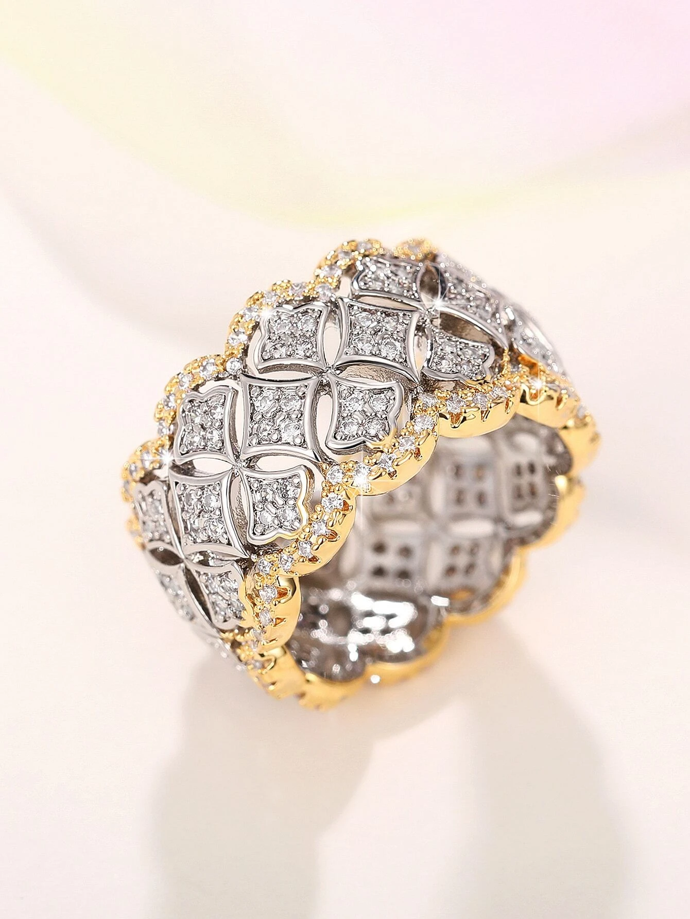 A stunning cubic zirconia decor ring with intricate details. The ring showcases a brilliant cubic zirconia gemstone set in an elegantly designed setting. The shimmering gemstone creates a captivating and glamorous look. This ring is a stylish and sophisticated accessory that adds a touch of elegance and luxury to any outfit.