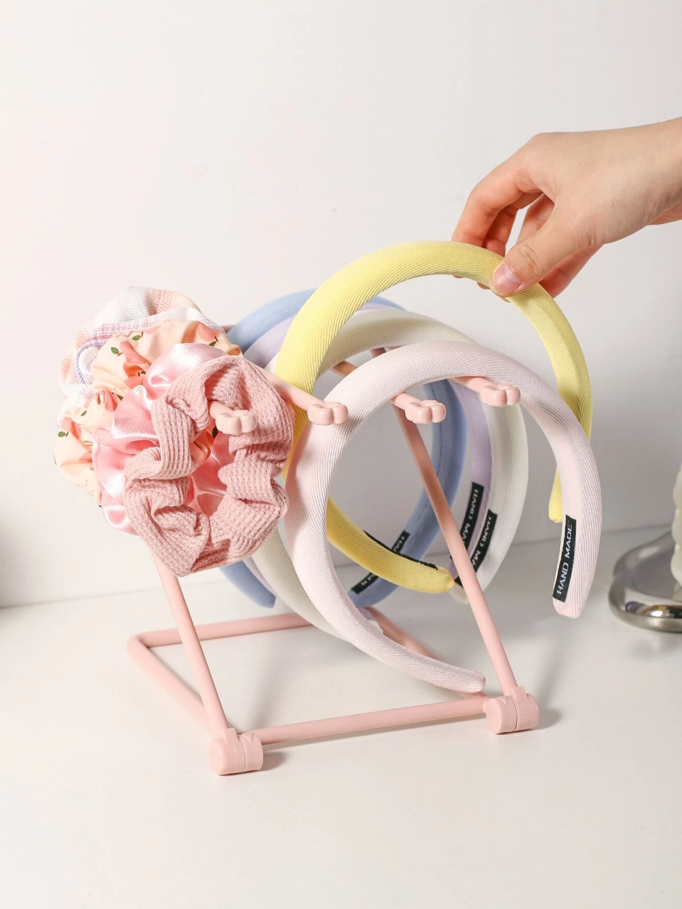 Foldable plastic rack for storing headwear, providing a convenient and space-saving solution for organizing your hats and accessories.