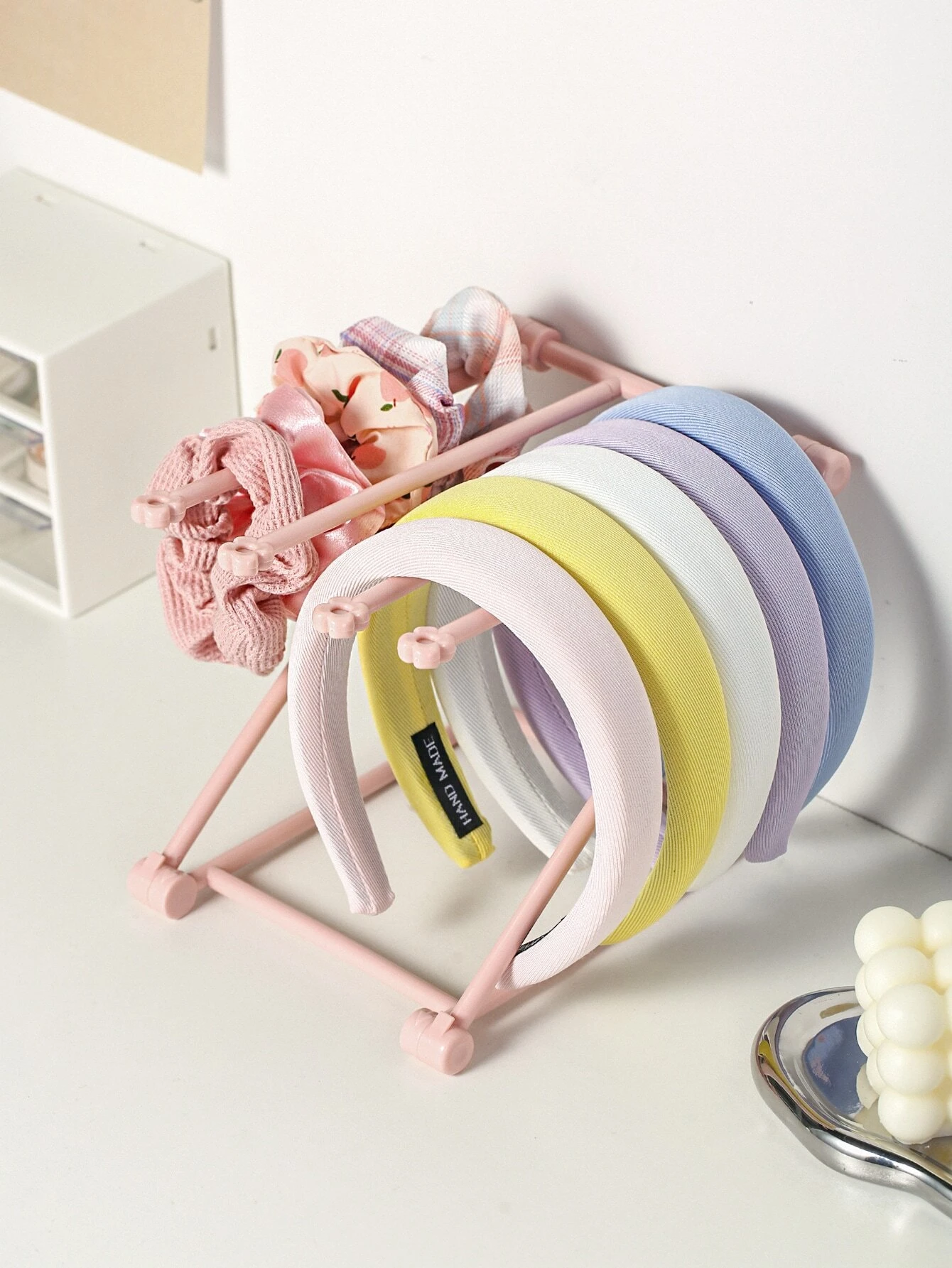 Foldable plastic rack for storing headwear, providing a convenient and space-saving solution for organizing your hats and accessories.