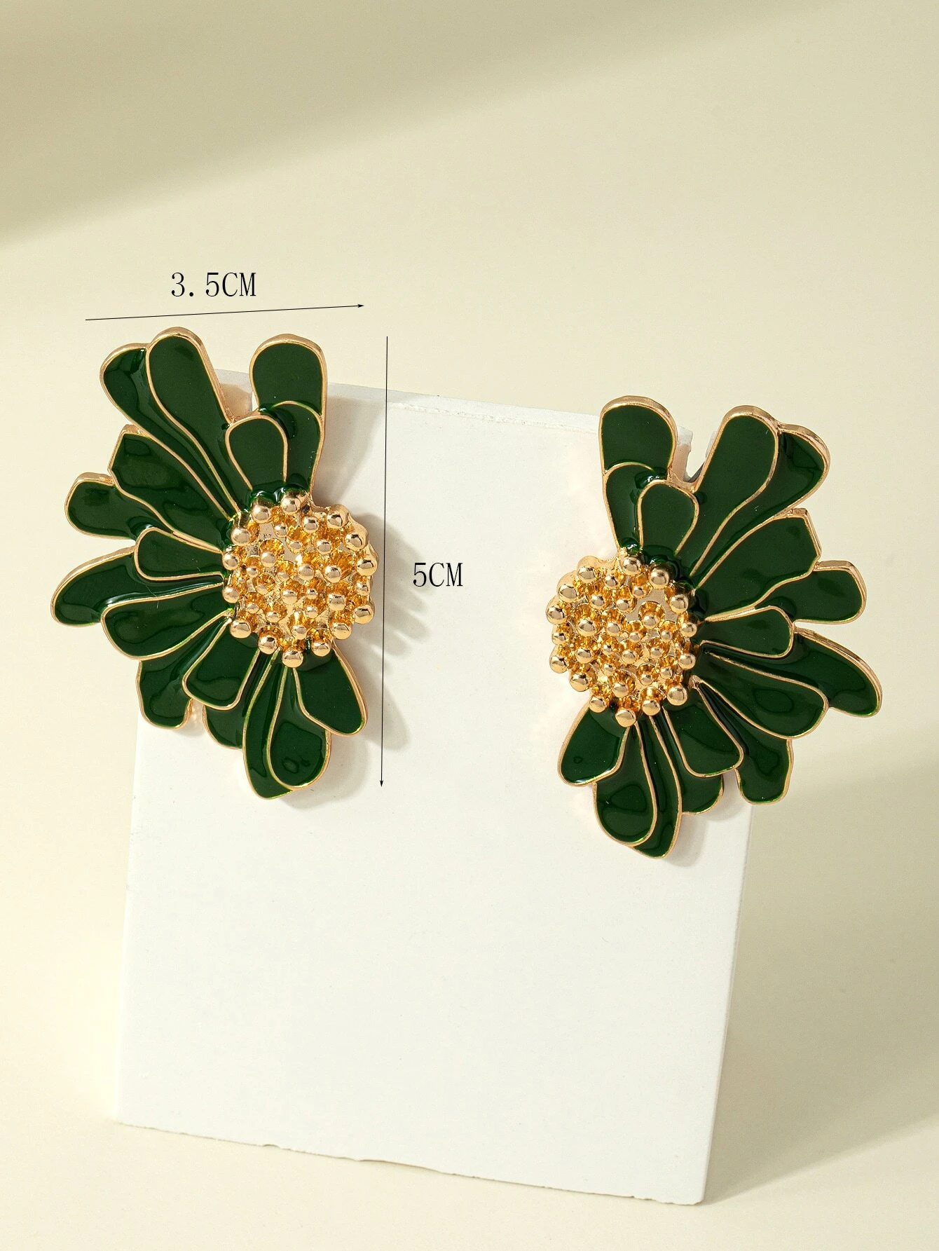 Green flower design stud earrings, featuring delicate floral patterns in a stylish and understated stud format.