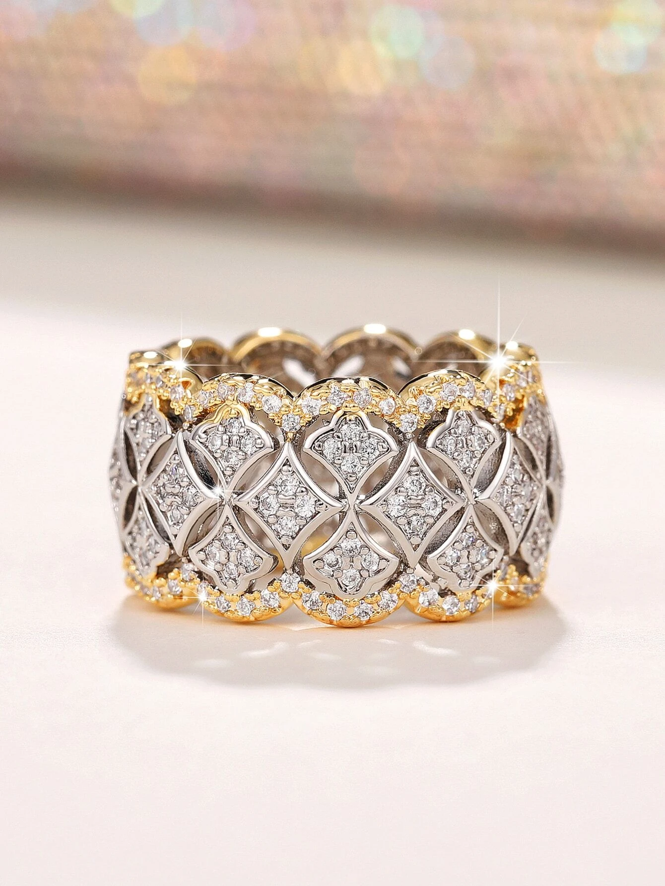 A stunning cubic zirconia decor ring with intricate details. The ring showcases a brilliant cubic zirconia gemstone set in an elegantly designed setting. The shimmering gemstone creates a captivating and glamorous look. This ring is a stylish and sophisticated accessory that adds a touch of elegance and luxury to any outfit.