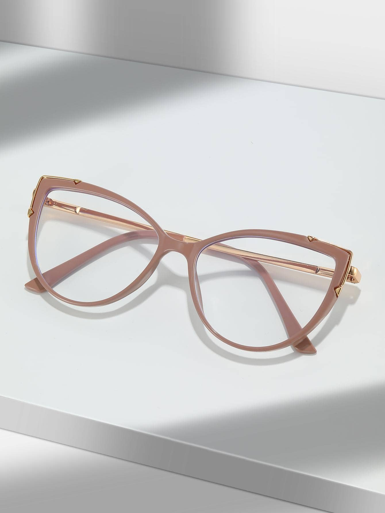 These Dusty Pink Cat Eye Anti-Blue Light Eyeglasses protect your eyes from the harm caused by blue-light emissions, such as digital eye strain, headaches, and blurry vision. The stylish cat-eye frame adds an extra touch of sophistication to your look.