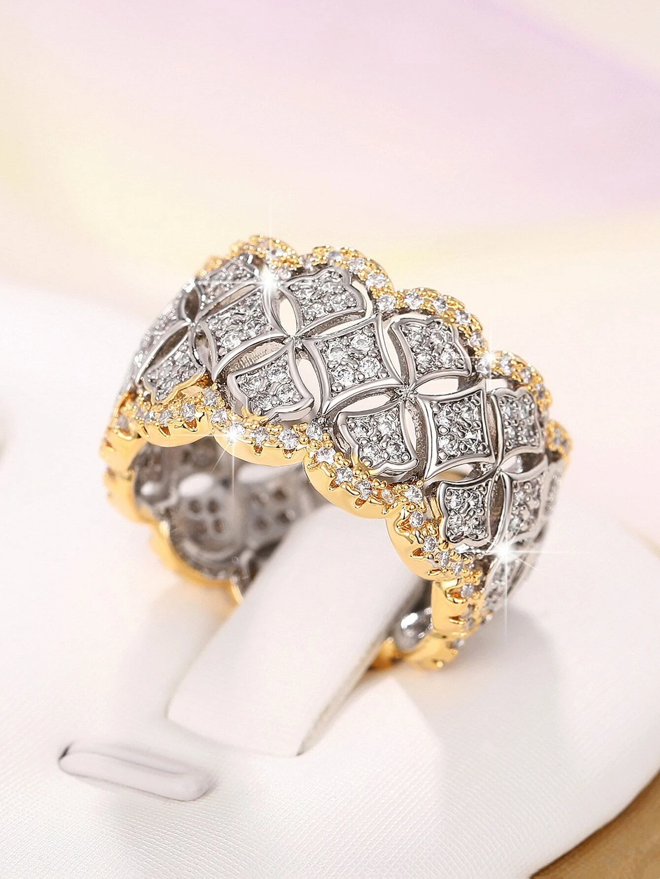 A stunning cubic zirconia decor ring with intricate details. The ring showcases a brilliant cubic zirconia gemstone set in an elegantly designed setting. The shimmering gemstone creates a captivating and glamorous look. This ring is a stylish and sophisticated accessory that adds a touch of elegance and luxury to any outfit.