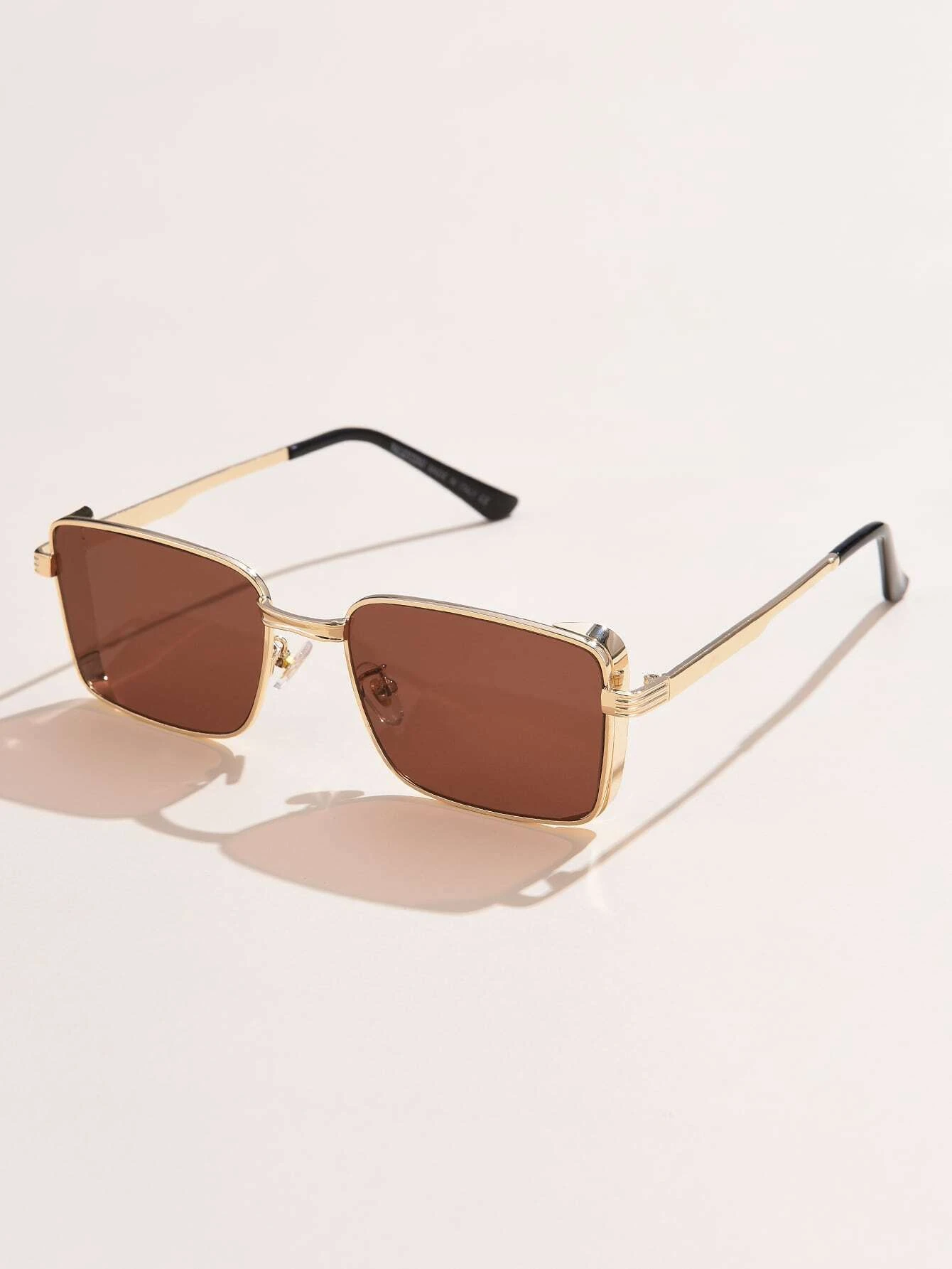 Pair of Tinted Lens Sunglasses with a fashionable and practical design. These sunglasses feature lenses with a tinted shade, combining style and sun protection for a versatile eyewear choice.