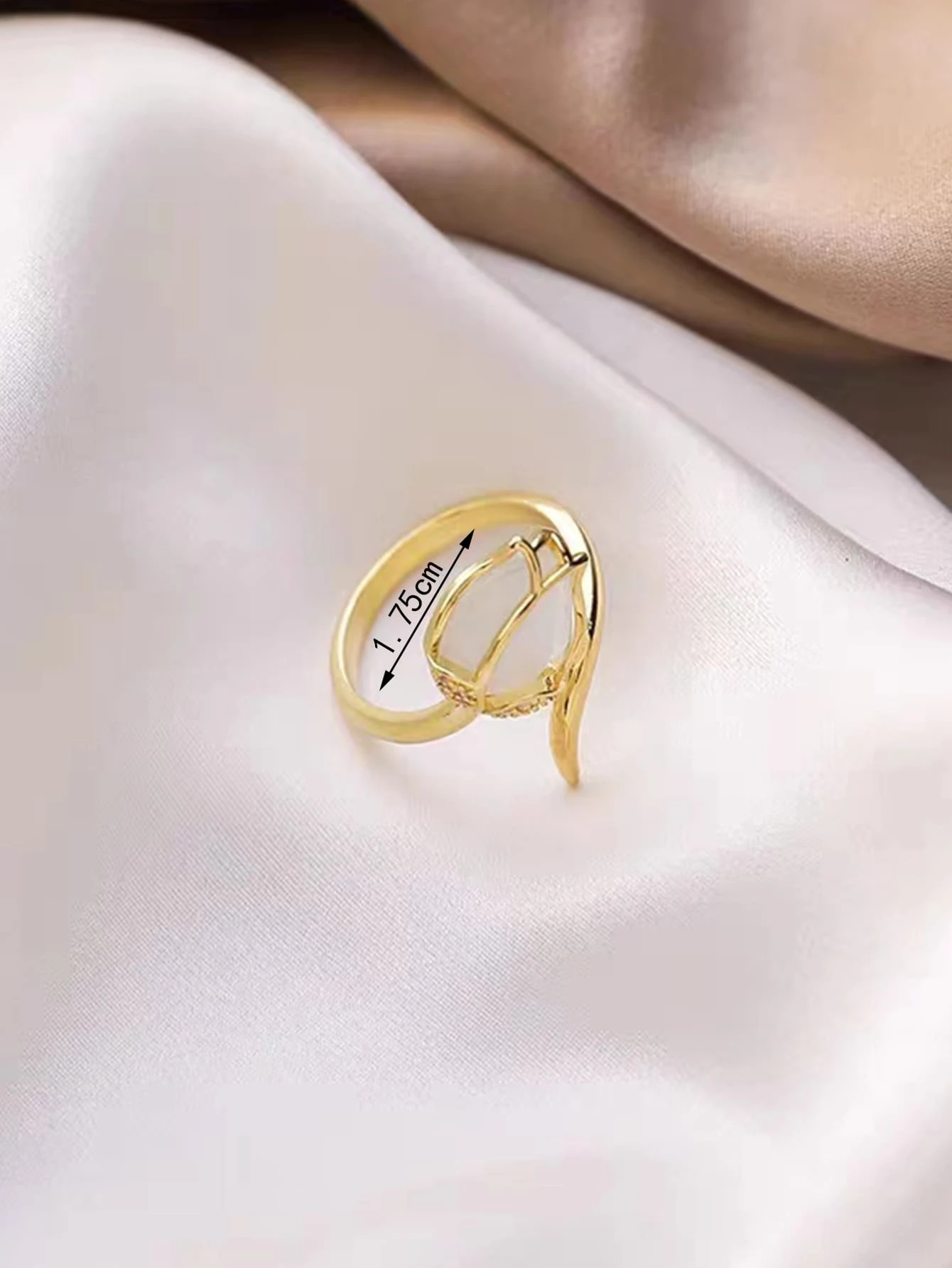 A distinctive flower decor cuff ring crafted from copper, showcasing intricate floral details. The ring features an open cuff design with a flower motif on one end, creating a stylish and artistic look. The warm copper tone and delicate floral embellishments add a touch of elegance and charm to this accessory. A fashionable and versatile piece of jewelry that can elevate various outfits