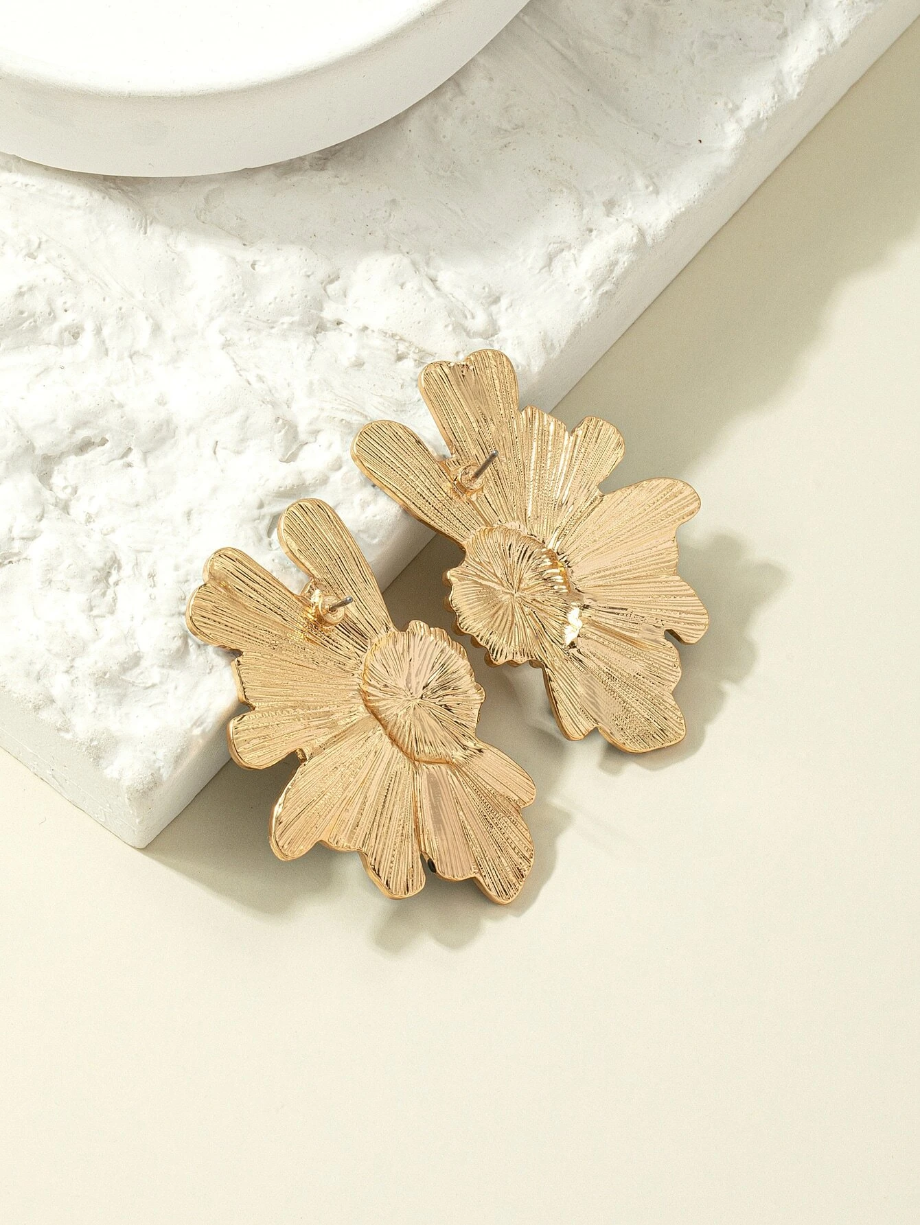 Green flower design stud earrings, featuring delicate floral patterns in a stylish and understated stud format.