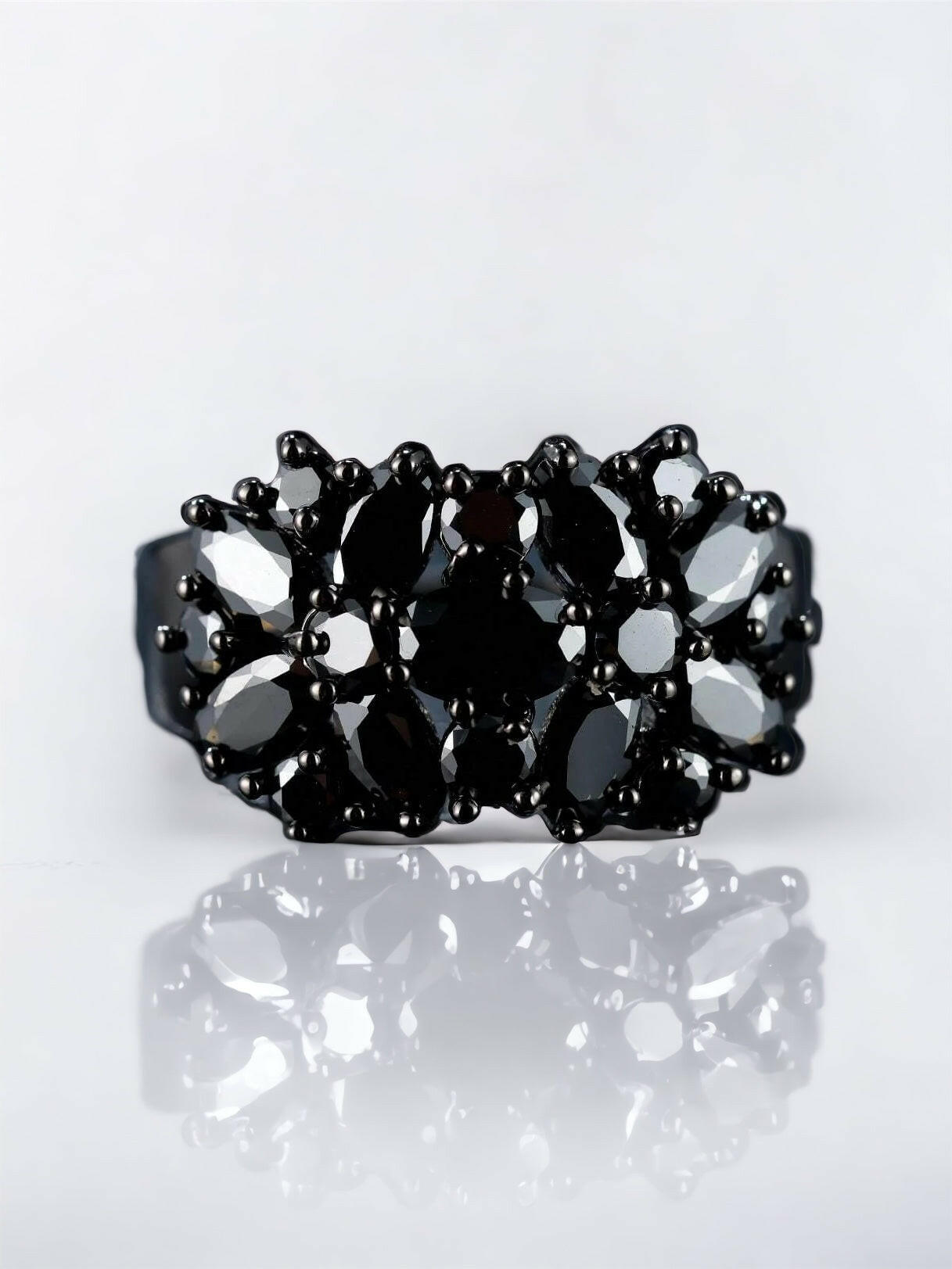 A chic cuff ring adorned with rhinestones, featuring intricate details. The ring showcases sparkling rhinestones set within an elegantly designed cuff-style band. The combination of the shimmering gems and the sleek metal creates a captivating and fashionable look. This cuff ring is a stylish and versatile accessory that adds a touch of elegance and glamour to any outfit.