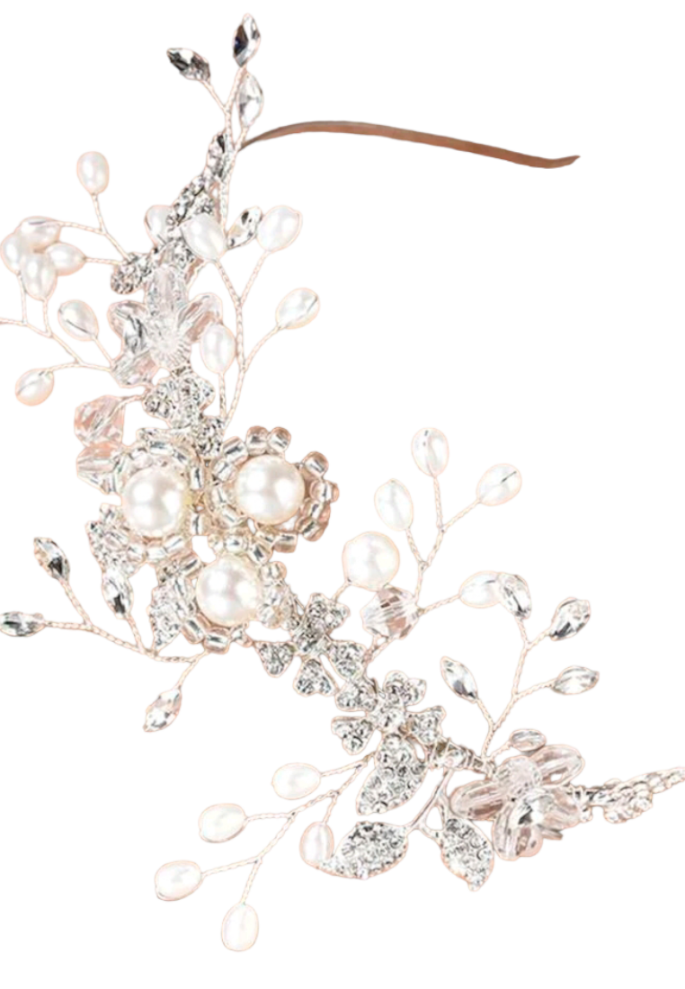 An elegant bridal headband adorned with faux pearls and delicate decorative elements. The headband features a graceful arrangement of lustrous faux pearls, creating a timeless and sophisticated look for brides on their special day.
