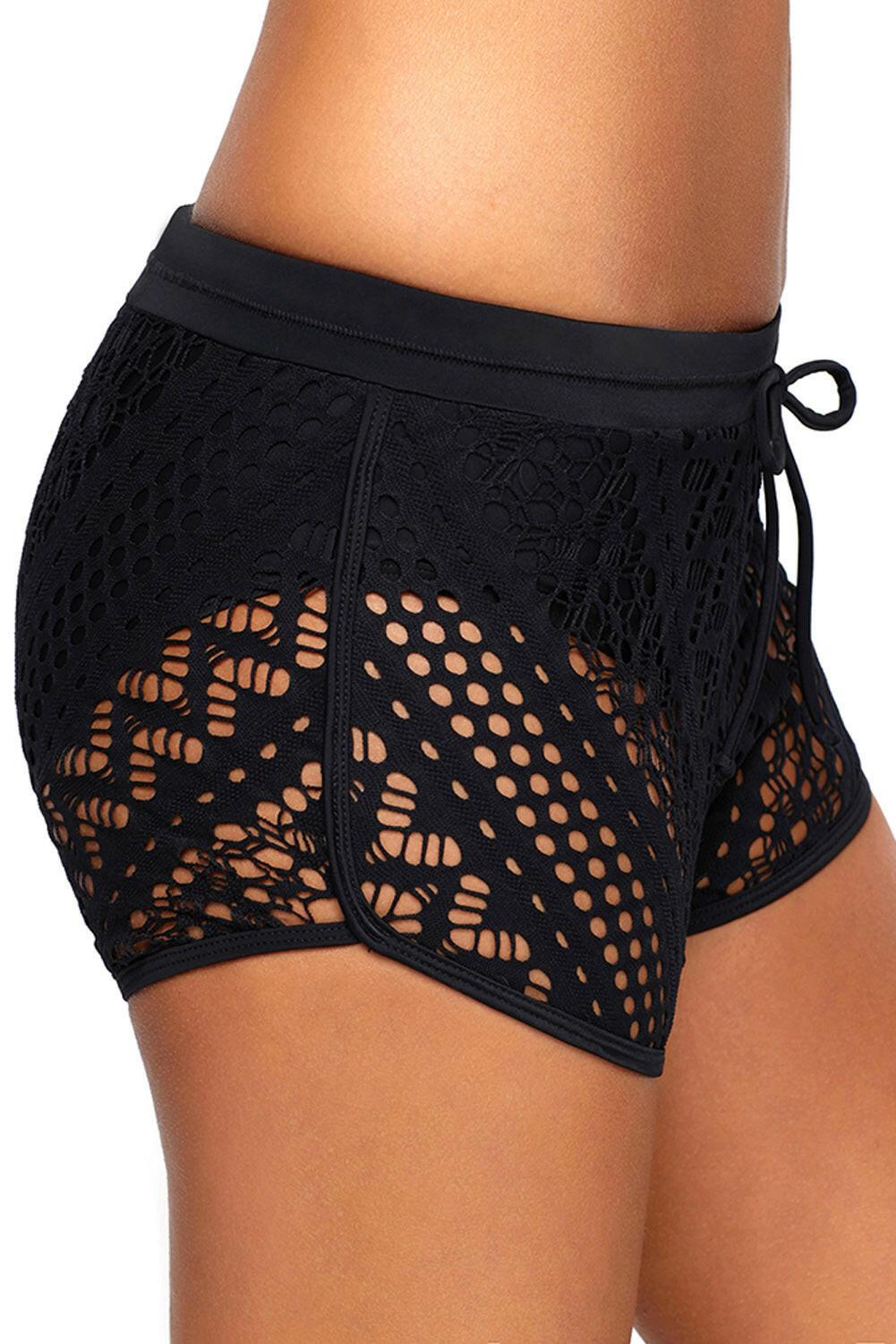 Black swim shorts with intricate hollow-out lace overlay. These shorts feature a sophisticated design with delicate lace patterns layered over a black base. The lace overlay adds a touch of elegance to the swimwear, creating a stylish and fashionable look. The shorts provide both comfort and coverage, making them a versatile choice for poolside or beach activities. The combination of black color and lace detailing exudes a sense of refinement and charm.