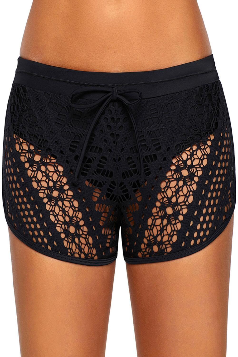 Black swim shorts with intricate hollow-out lace overlay. These shorts feature a sophisticated design with delicate lace patterns layered over a black base. The lace overlay adds a touch of elegance to the swimwear, creating a stylish and fashionable look. The shorts provide both comfort and coverage, making them a versatile choice for poolside or beach activities. The combination of black color and lace detailing exudes a sense of refinement and charm.