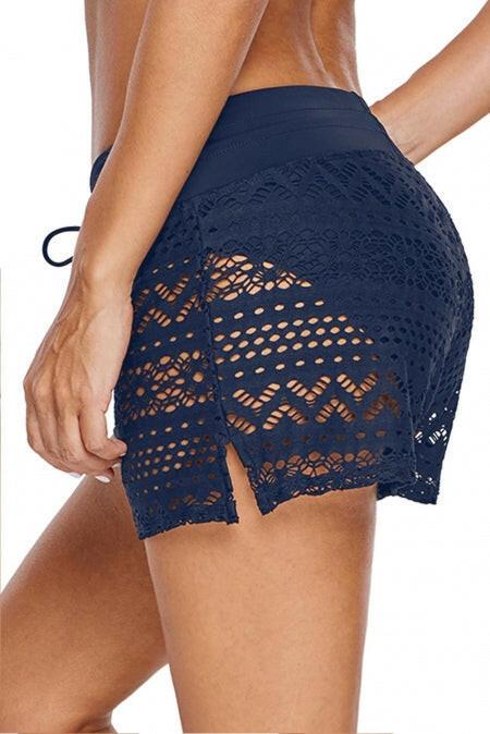 Swim bottom with attached blue lace shorts. These shorts feature a lovely blue lace design, seamlessly integrated with the swimwear bottom. The shorts offer a unique and stylish twist to traditional swimwear, combining comfort and fashion. The blue lace adds a touch of sophistication, making this swim bottom a versatile choice for poolside or beach outings. The attached lace shorts bring a playful and trendy element to the overall look.