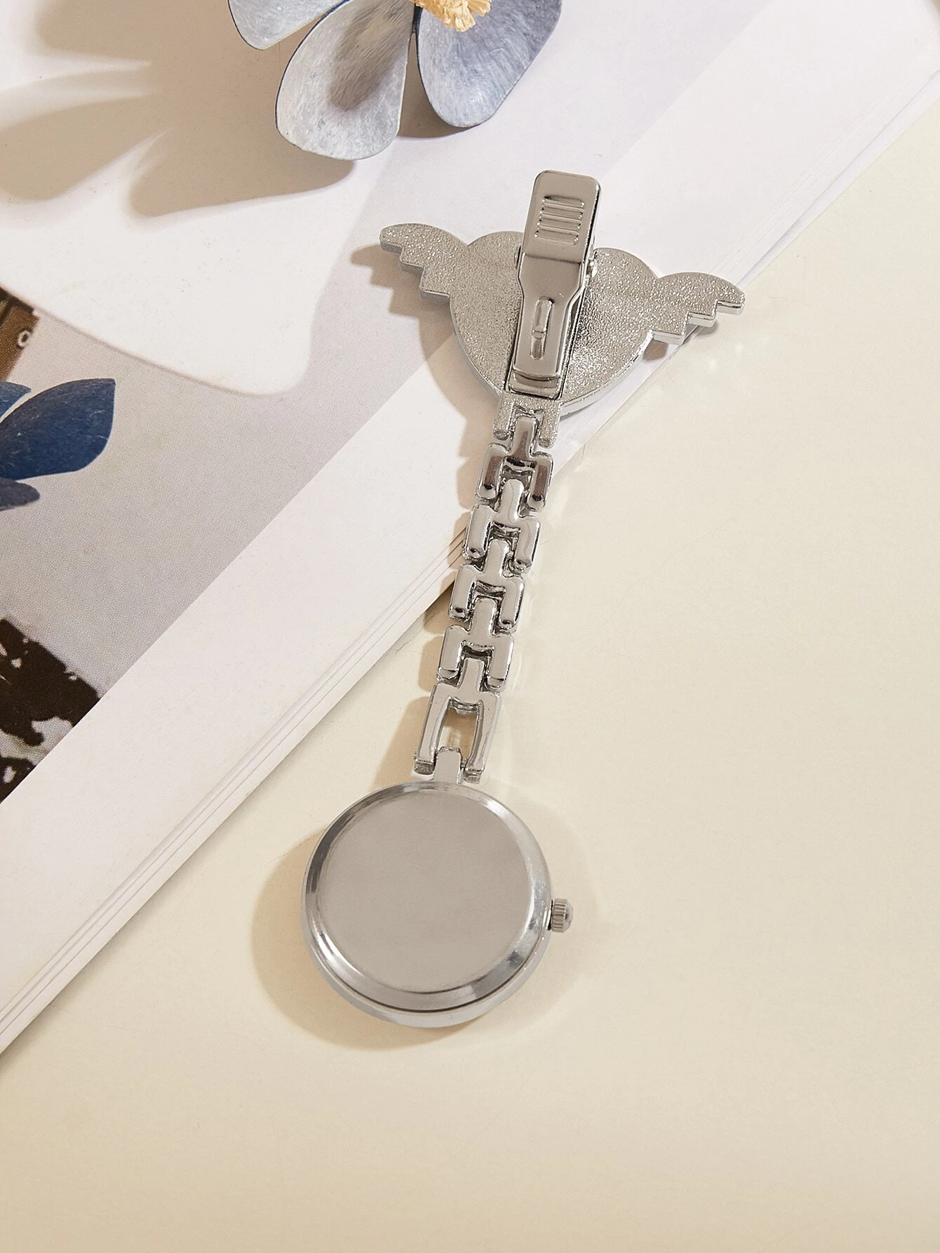 Quartz watch brooch featuring a heart and nurse design, combining style and functionality for a unique accessory suitable for healthcare professionals.