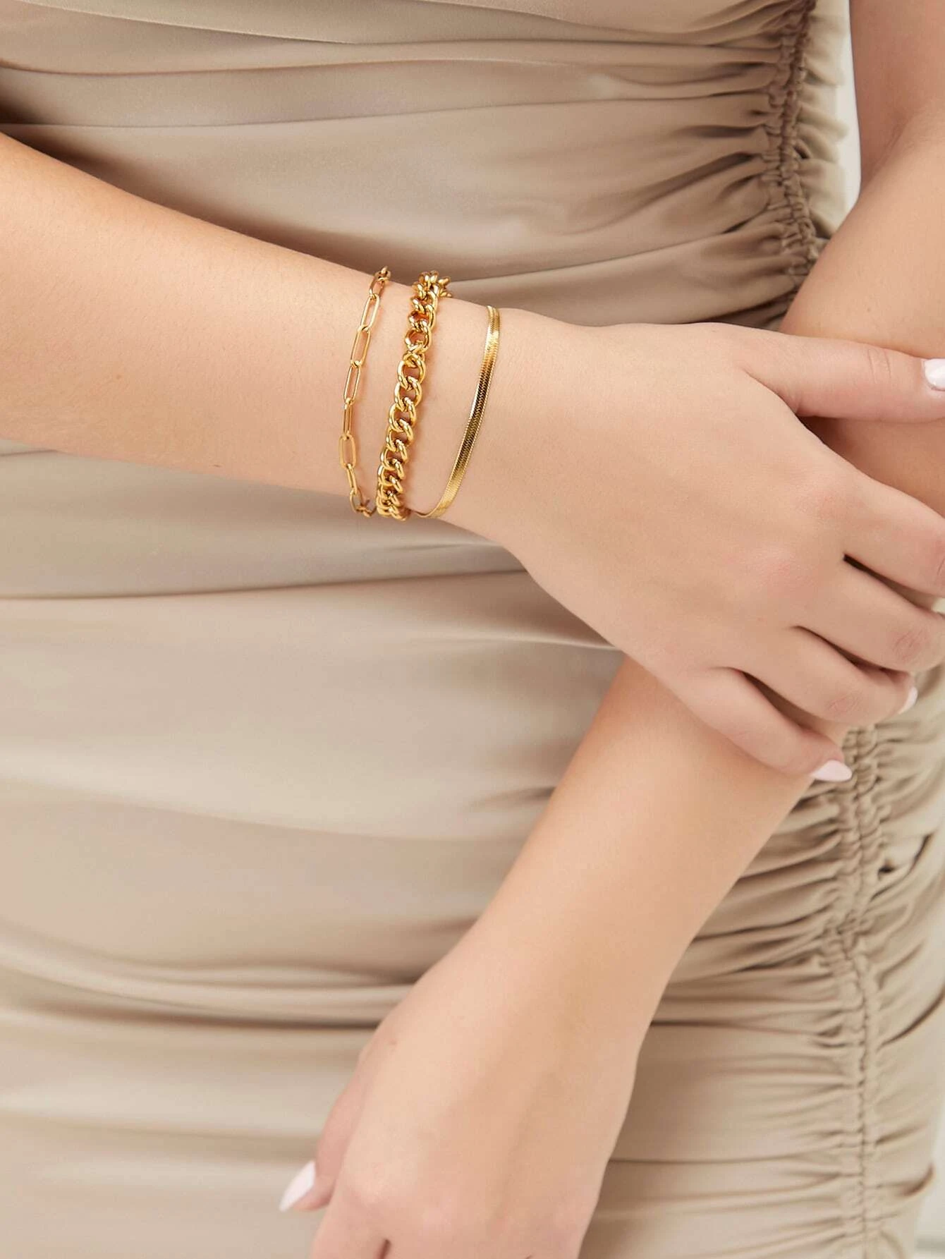 Set of three minimalist link bracelets, showcasing sleek and modern design. Each bracelet features clean, interlocking links, creating a chic and versatile accessory. The trio can be worn individually or stacked for a stylish layered look, suitable for both casual and dressier occasions.