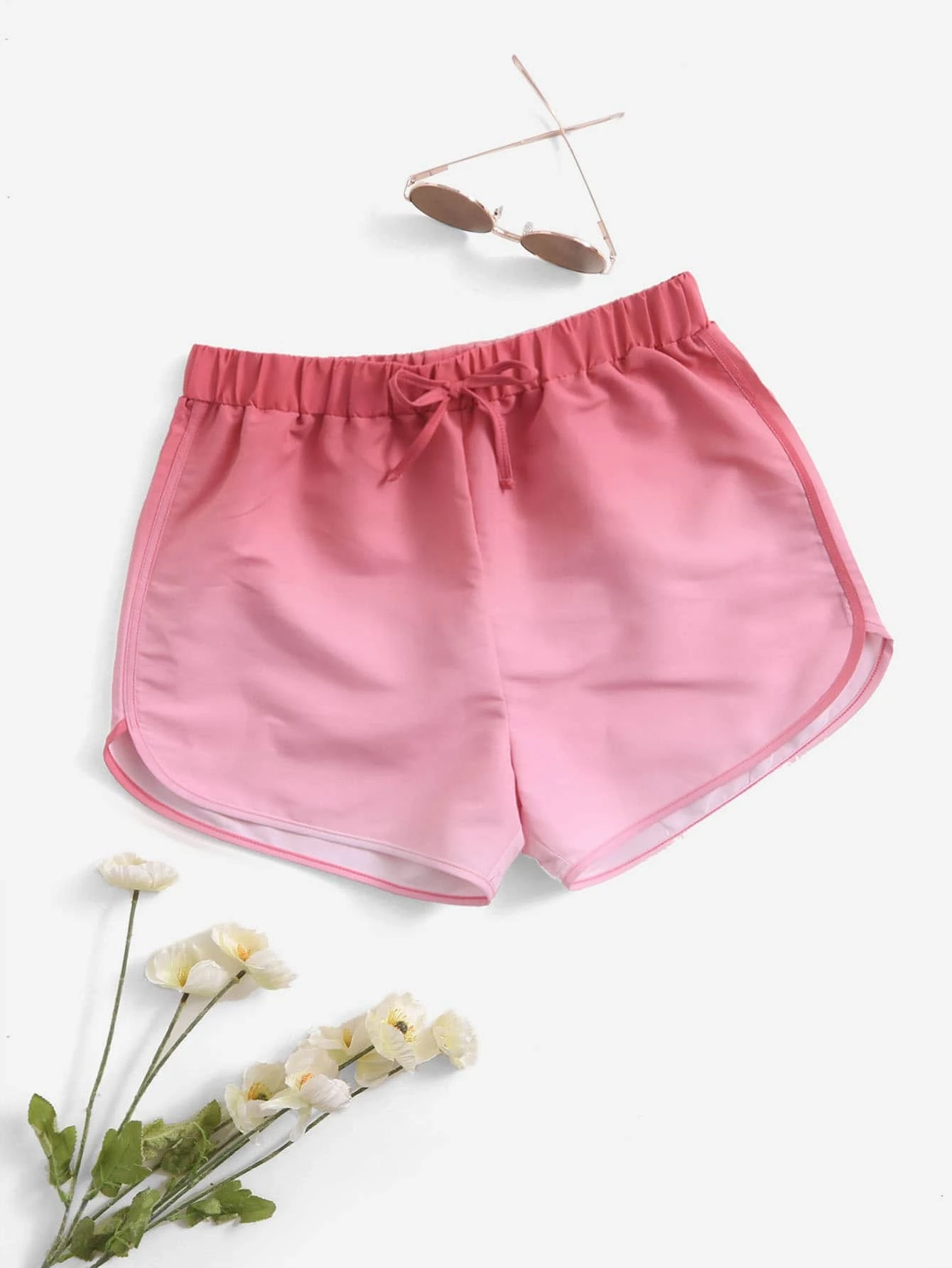 Ombre swim shorts with gradient color design. These swim shorts feature a captivating ombre color transition, adding a touch of style to your beach or pool look. A fashionable choice for water-related activities, combining aesthetic appeal and comfort in a versatile swimwear option.