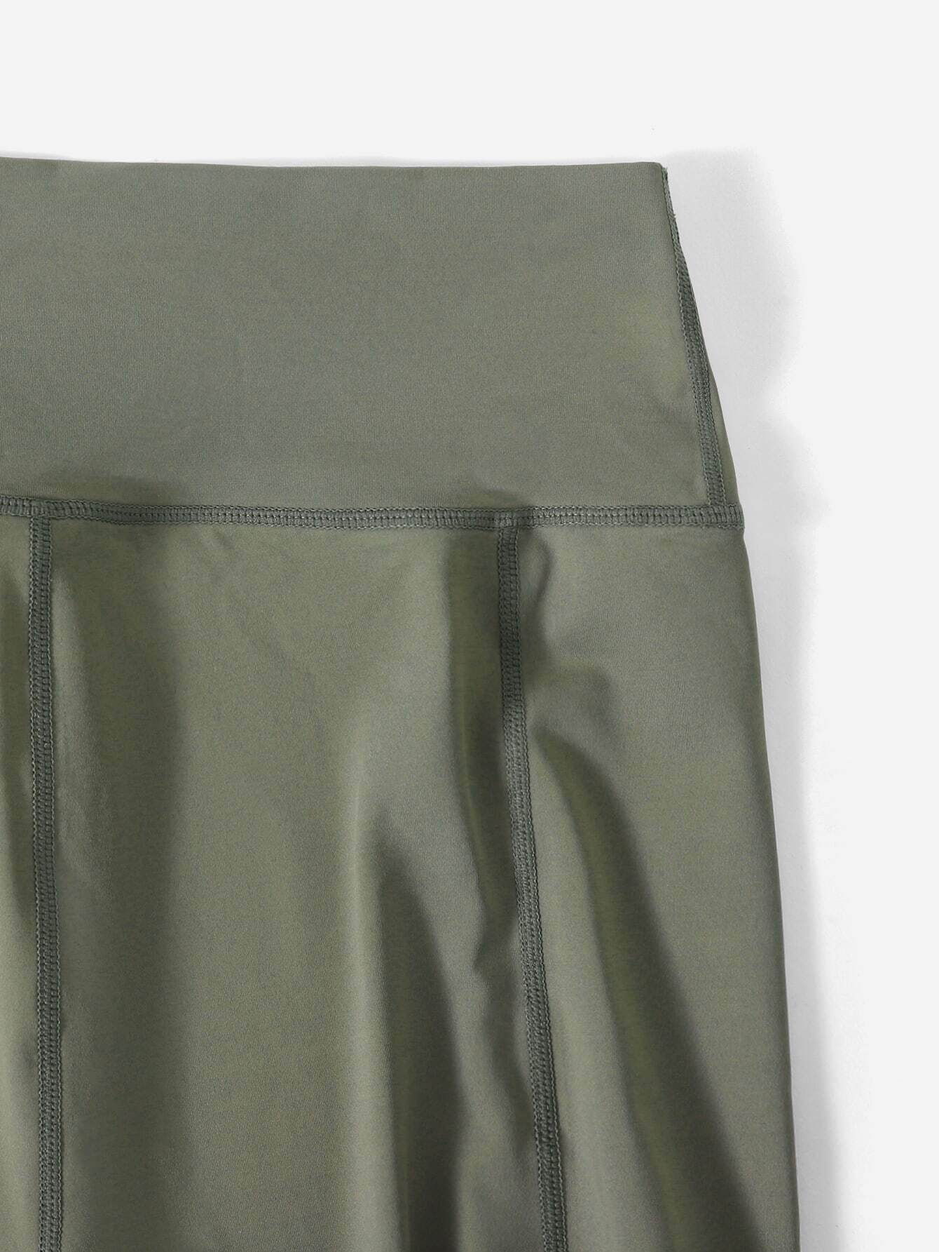 Image of a 3-piece breathable sports set. The set includes a top, leggings, and matching accessories, all crafted from breathable materials, providing comfort and functionality for various physical activities.