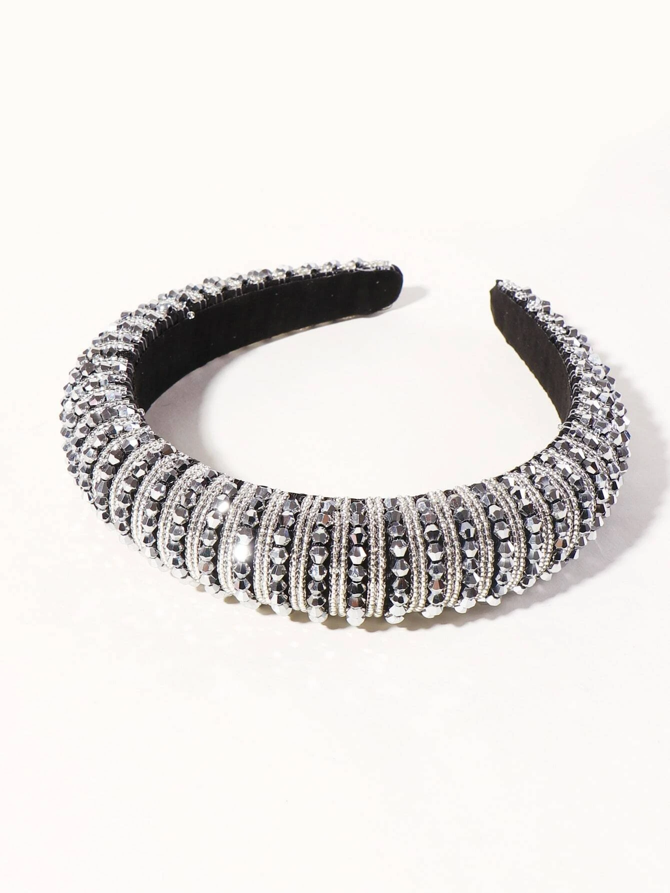 A hair hoop embellished with beads, creating a stylish and eye-catching accessory for your hair.