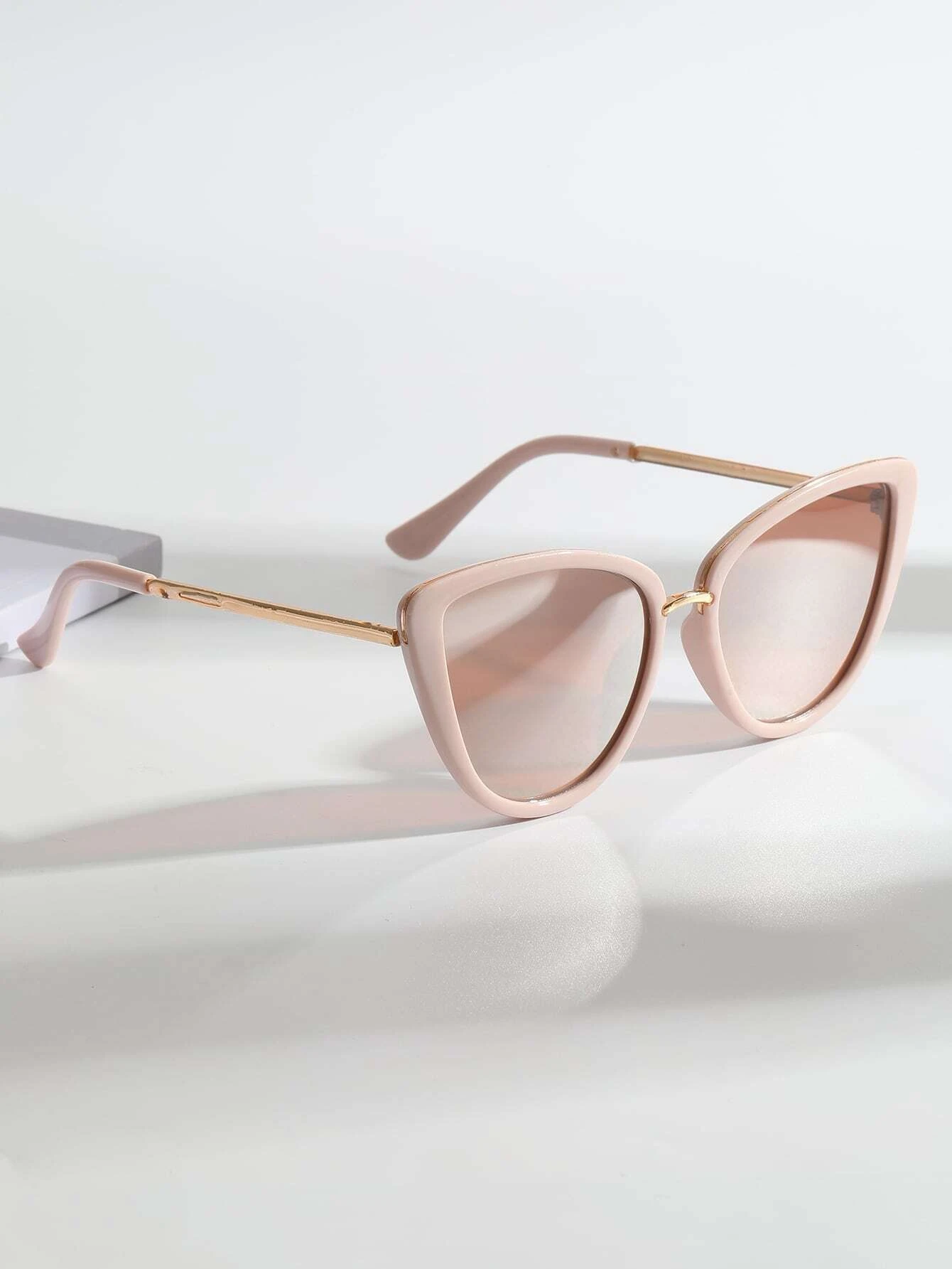 Pair of Cat Eye Fashion Sunglasses with stylish and feminine design. These sunglasses feature the classic cat-eye frame shape, offering a blend of vintage charm and modern fashion.