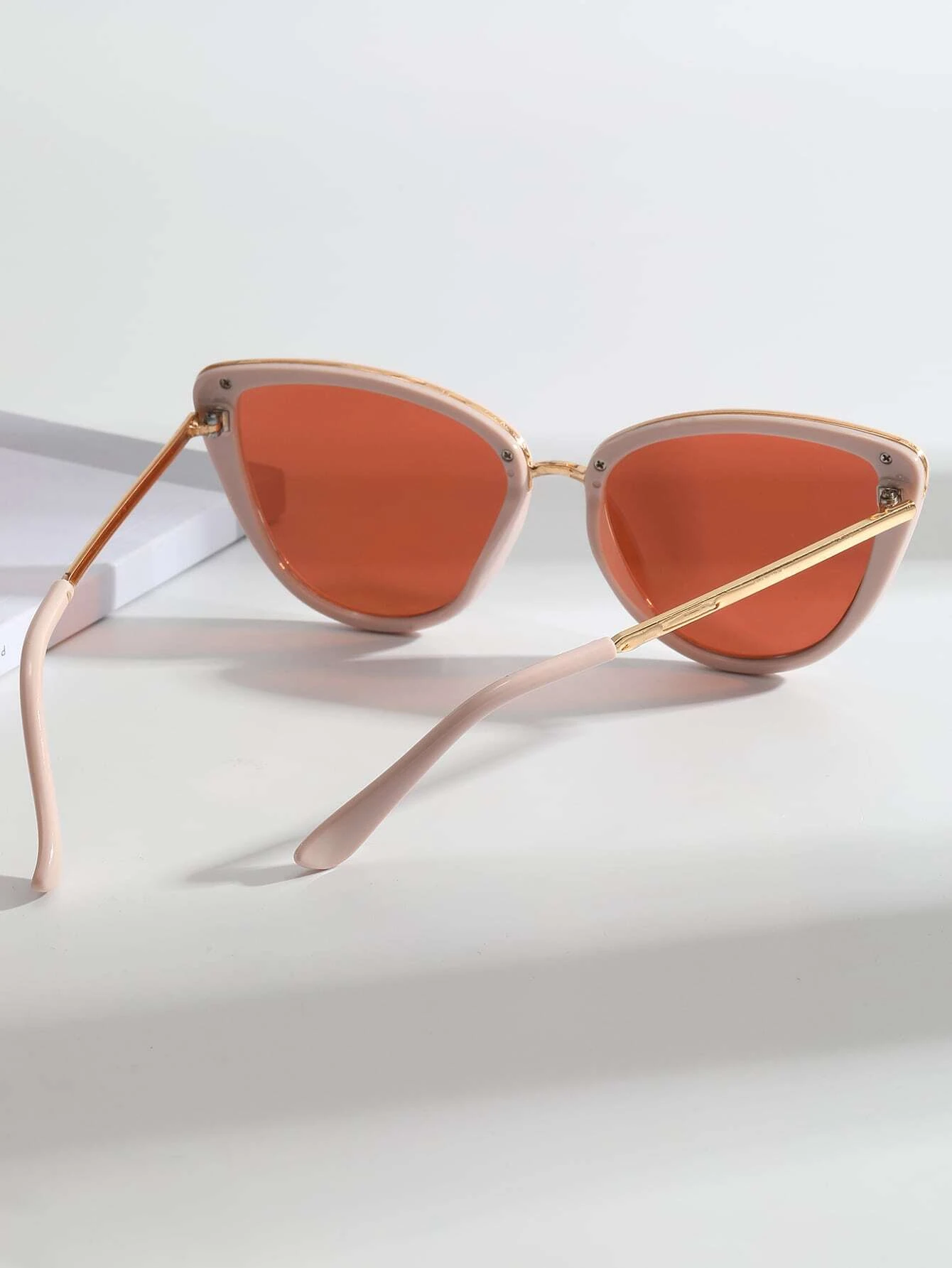 Pair of Cat Eye Fashion Sunglasses with stylish and feminine design. These sunglasses feature the classic cat-eye frame shape, offering a blend of vintage charm and modern fashion.