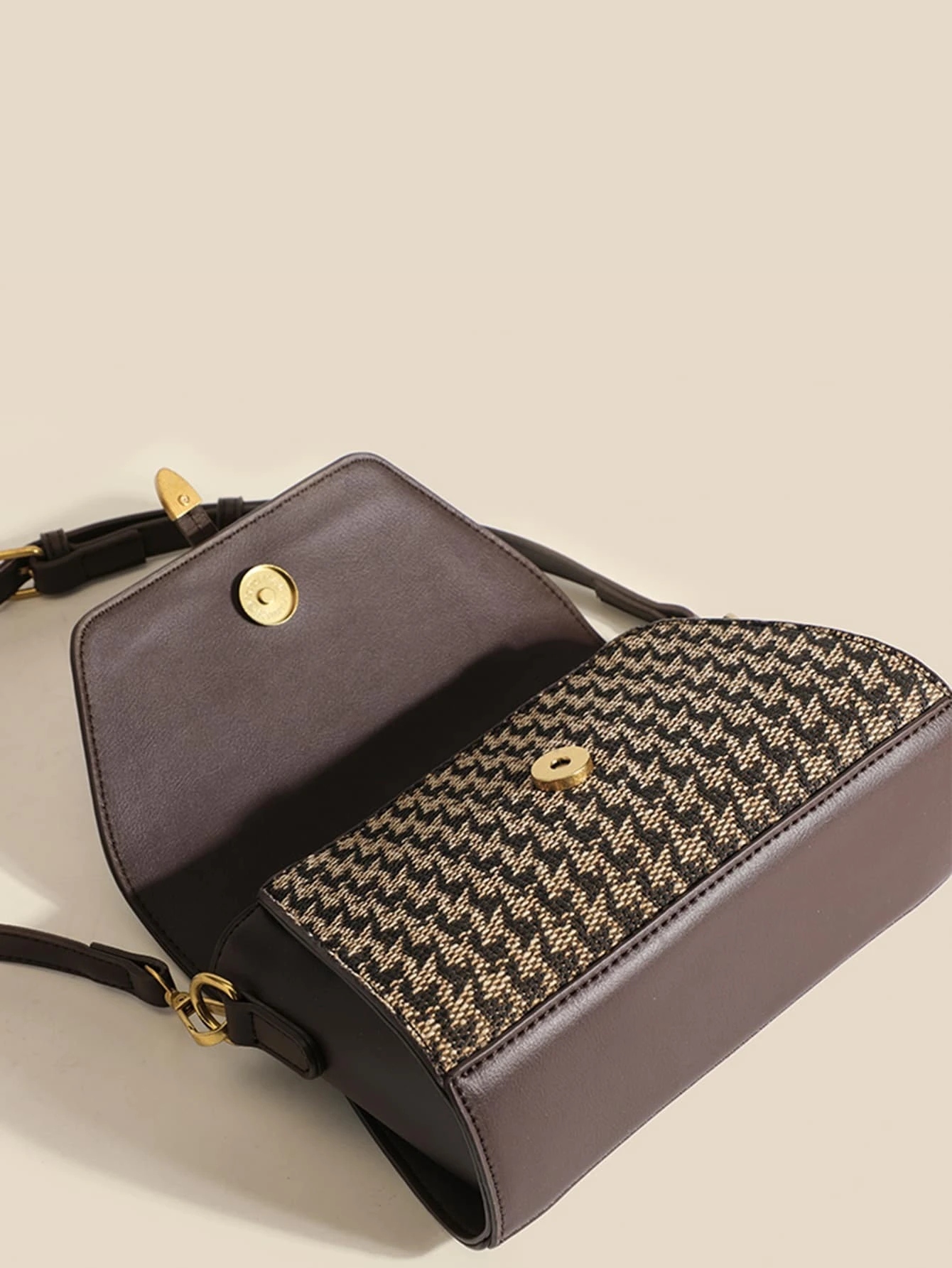 Mini square bag with houndstooth pattern flap. This accessory combines classic design with modern elements, offering a chic and stylish way to carry your essentials.