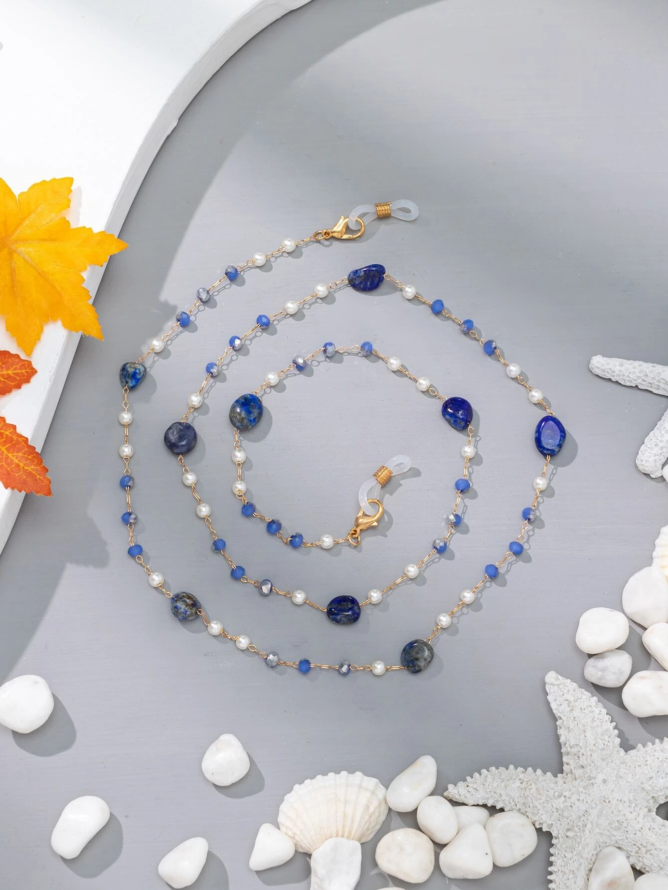 Glasses chain with faux pearl accents, a stylish and practical accessory for keeping your eyewear close.