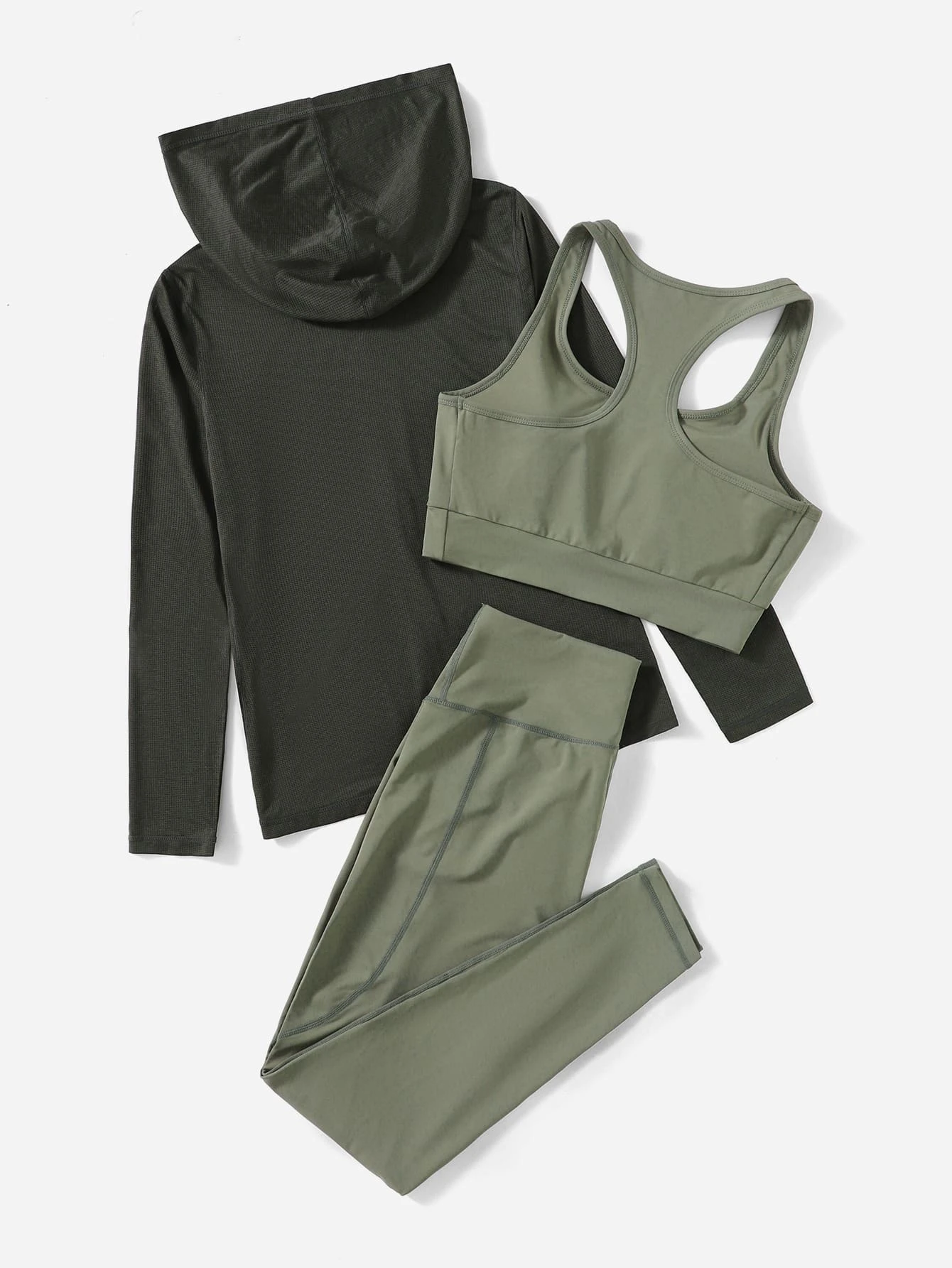Image of a 3-piece breathable sports set. The set includes a top, leggings, and matching accessories, all crafted from breathable materials, providing comfort and functionality for various physical activities.