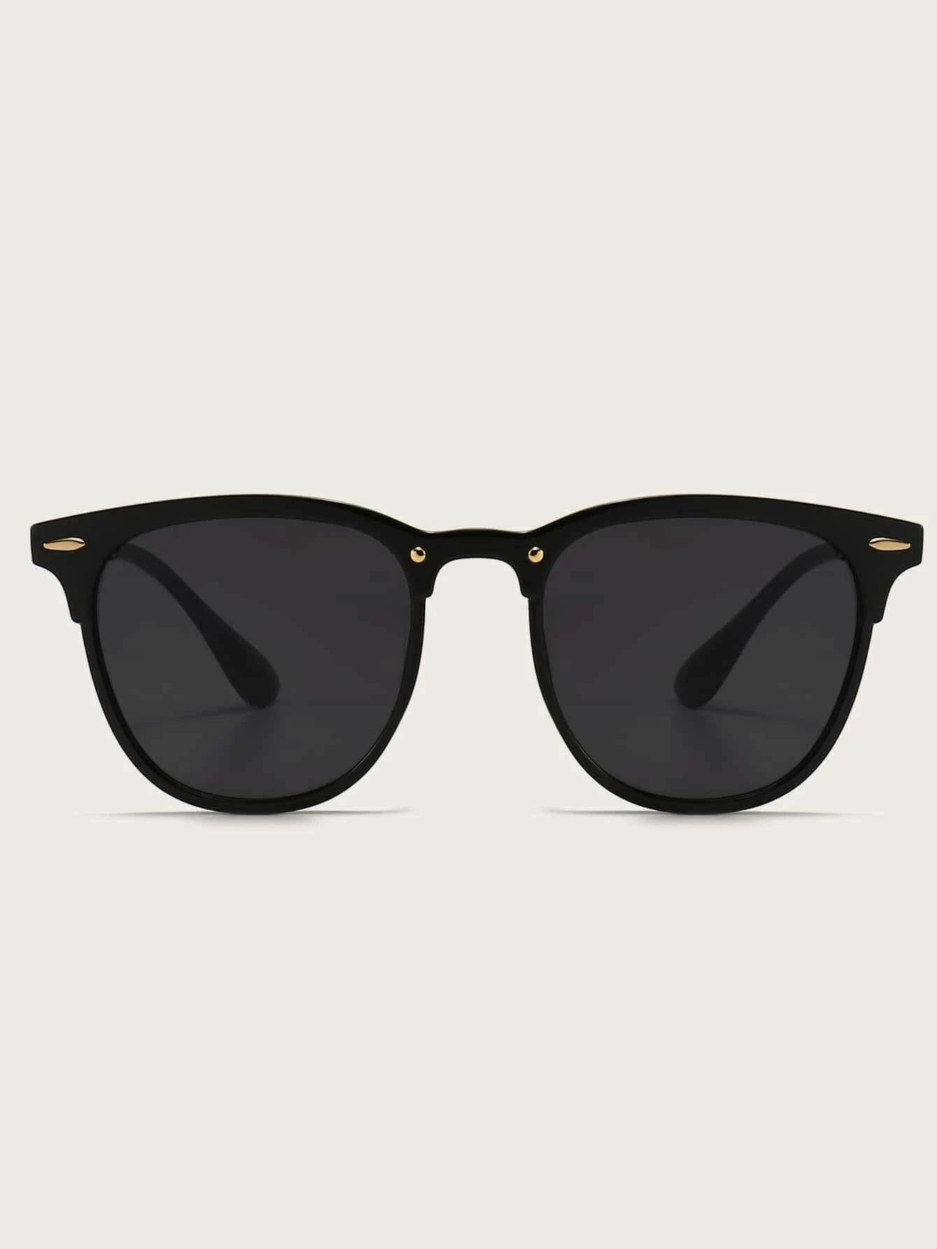 Pair of sleek Minimalist Sunglasses with a timeless design. The sunglasses feature a minimalist frame shape and tinted lenses for sun protection. Their simple yet elegant style makes them versatile for various occasions.