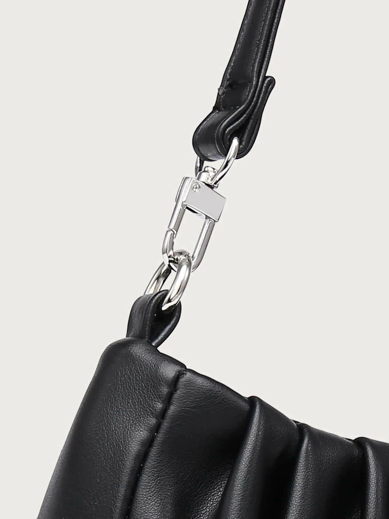 Shoulder bag with minimalist ruched design. This accessory offers a chic and stylish way to carry your essentials, combining modern simplicity with a touch of texture."