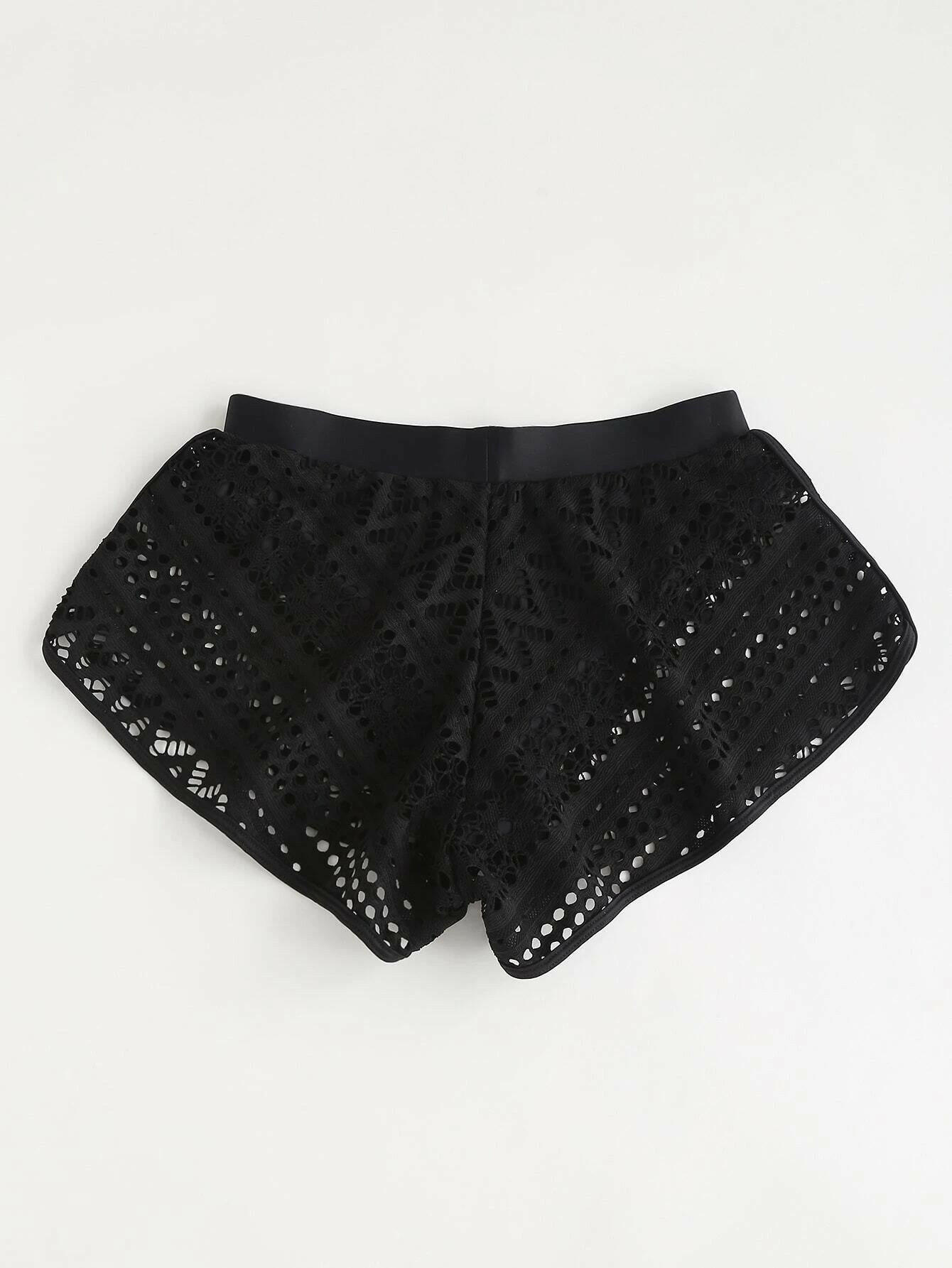 Black bikini shorts with stylish hollow-out detailing. These shorts showcase a chic and edgy design, featuring intricate hollow-out patterns against a black backdrop. The cut and style provide a comfortable and flattering fit, making them a trendy choice for swimwear. The hollow-out elements add a touch of flair to the classic black bikini shorts, perfect for a bold and fashionable beach or poolside statement.