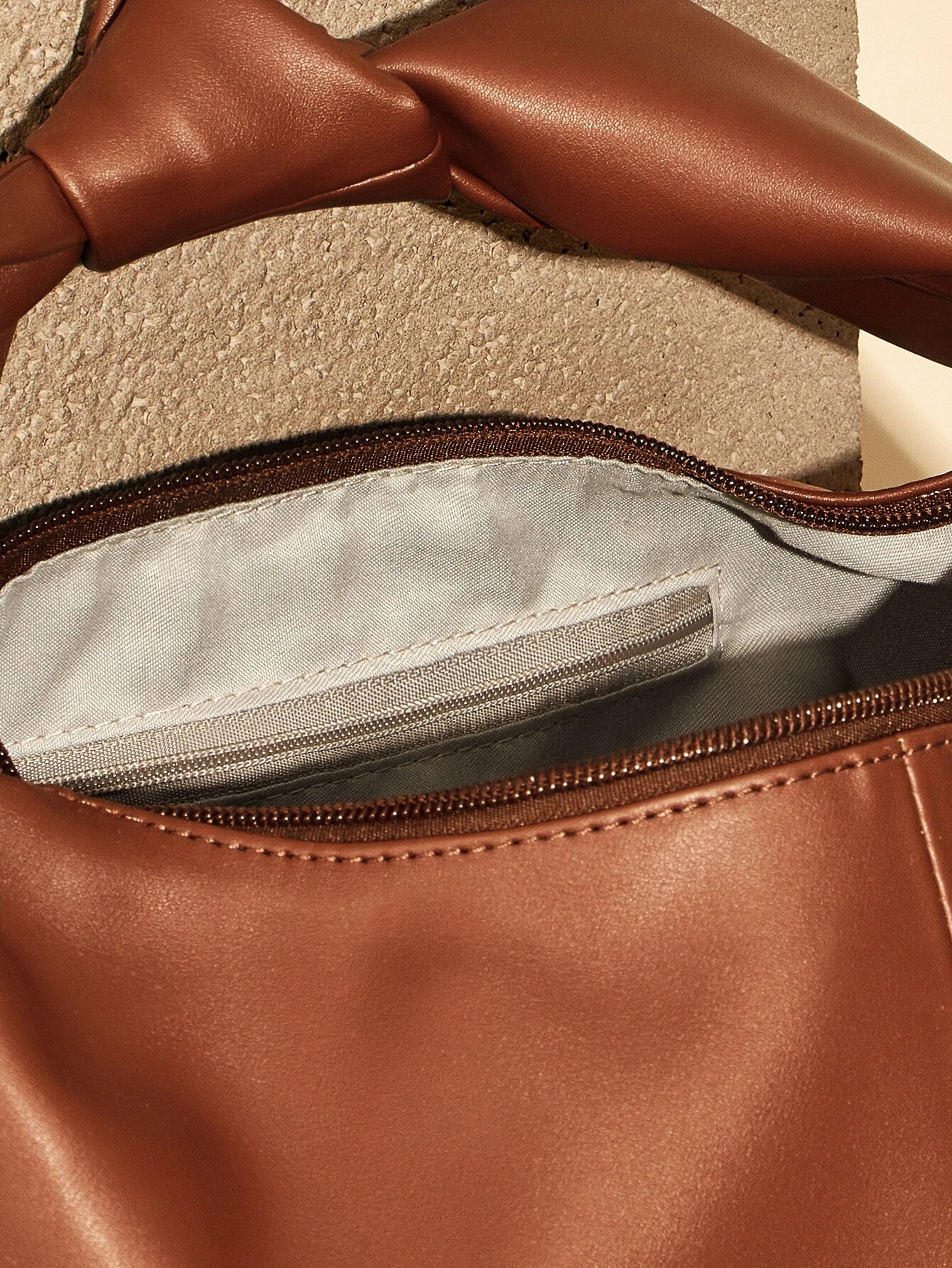 Minimalist baguette bag with clean lines and sleek design. This accessory offers a simple yet stylish way to carry your essentials, embodying modern elegance and functionality.