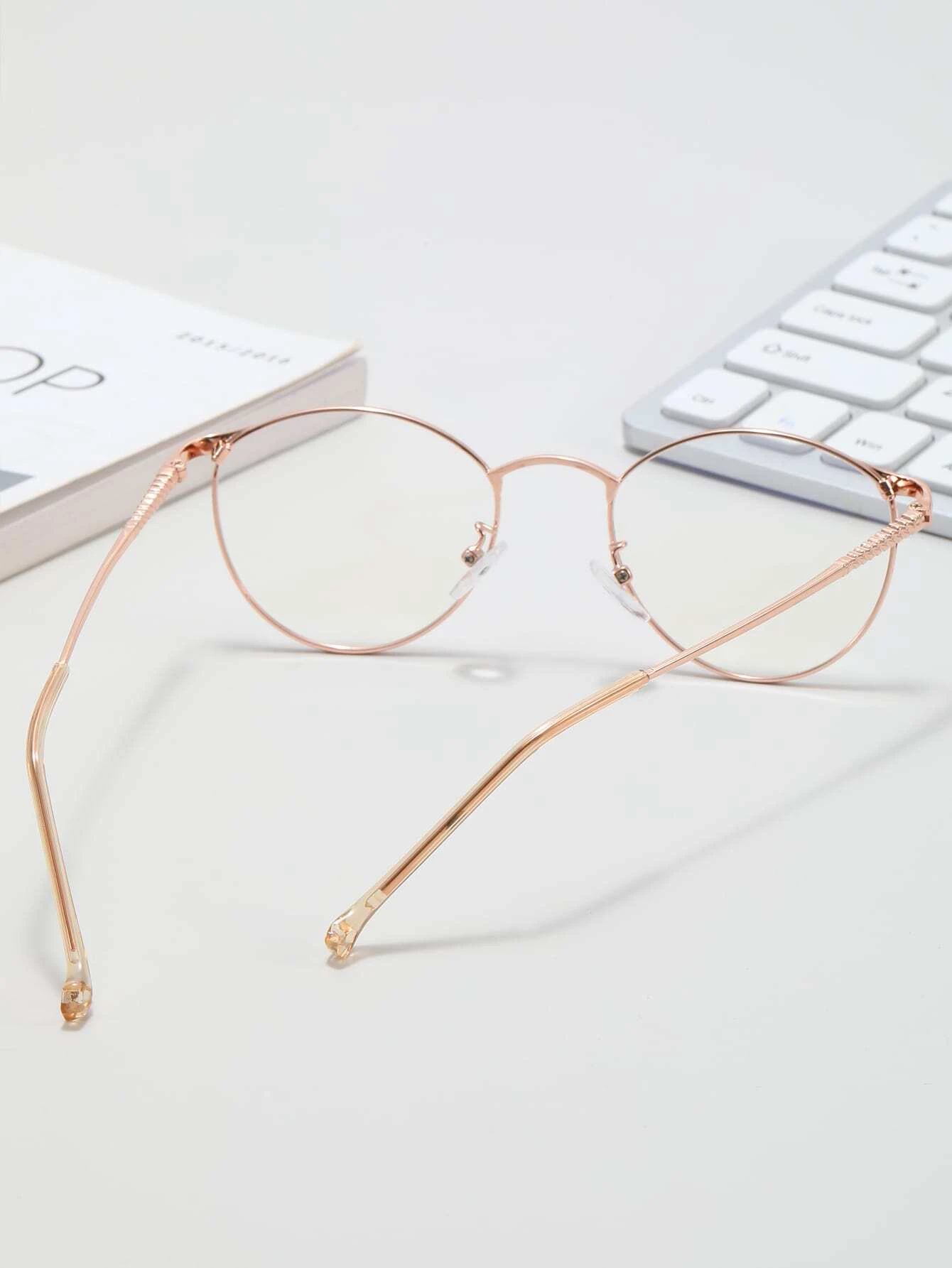 These Metal Frame Anti-Blue Light Eyeglasses offer UV400 protection and reduce blue light radiation from digital screens without sacrificing style. Their metal frame is both lightweight and durable, making them comfortable to wear for hours of continuous use. Enjoy reduced eye strain and improved sleep quality with these eyeglasses.