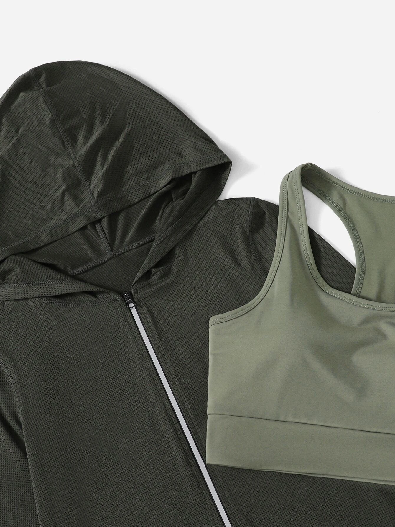 Image of a 3-piece breathable sports set. The set includes a top, leggings, and matching accessories, all crafted from breathable materials, providing comfort and functionality for various physical activities.