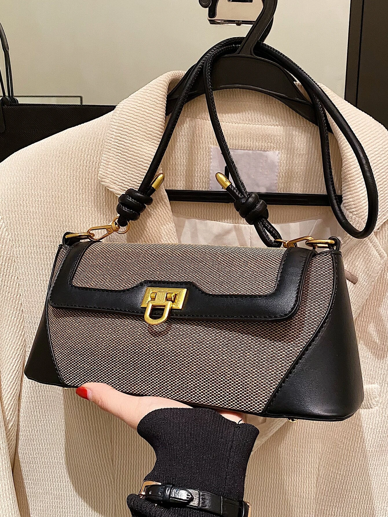 Two-tone flap baguette bag with a blend of colors. This accessory offers a sleek and stylish way to carry your essentials, embodying modern elegance and functionality.