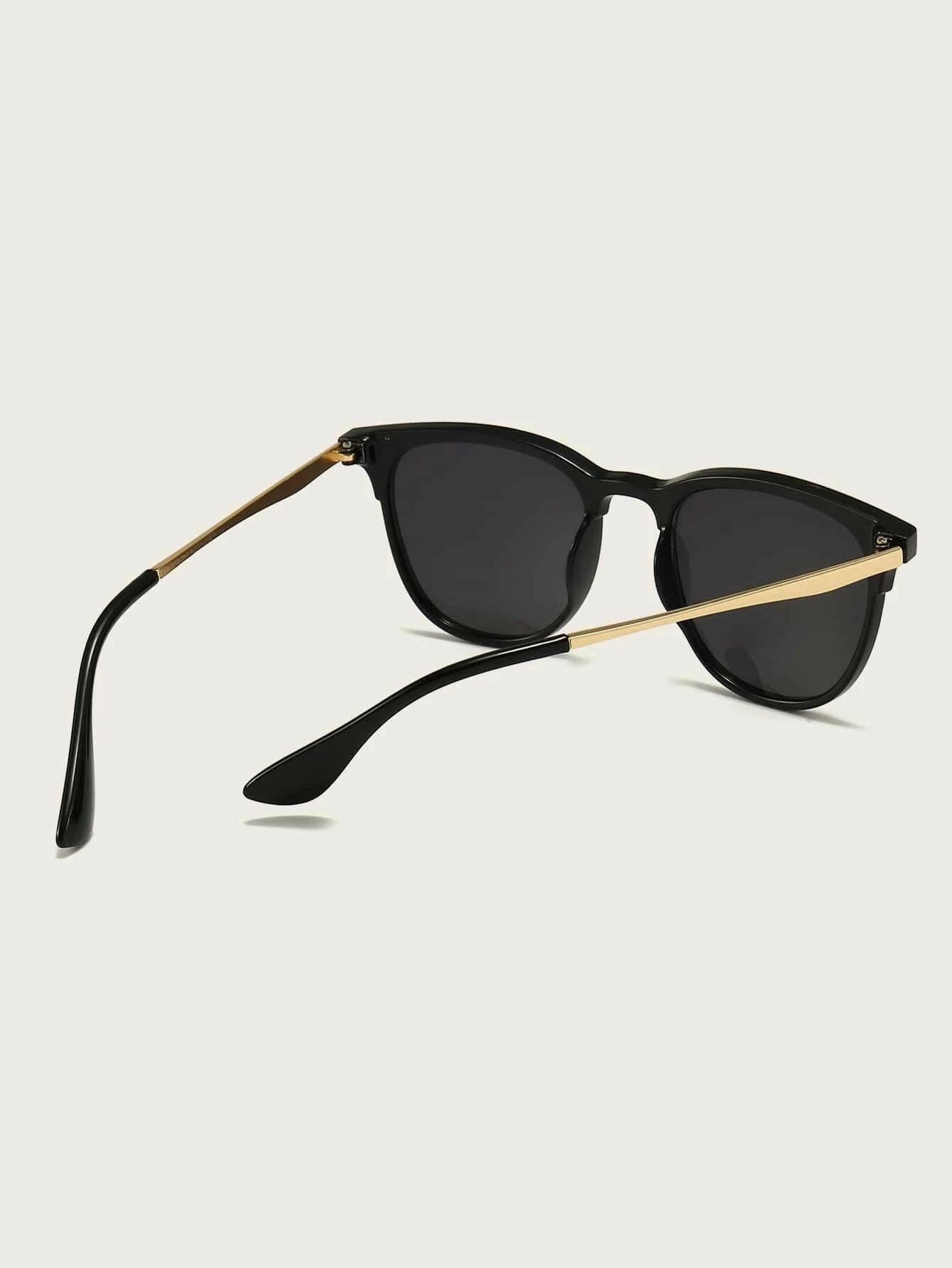 Pair of sleek Minimalist Sunglasses with a timeless design. The sunglasses feature a minimalist frame shape and tinted lenses for sun protection. Their simple yet elegant style makes them versatile for various occasions.