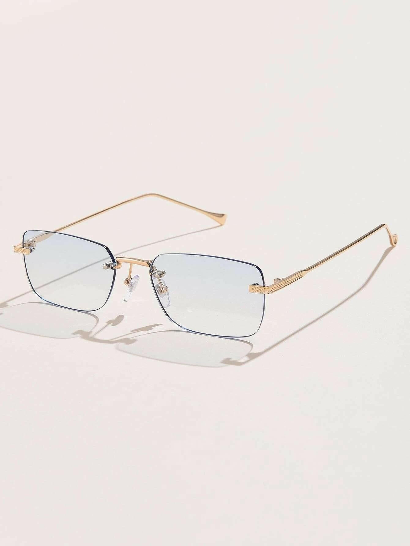 Square Rimless Sunglasses with a sleek and minimalist design. These sunglasses feature square-shaped lenses held by a rimless frame, offering a chic and lightweight option for sun protection and style.