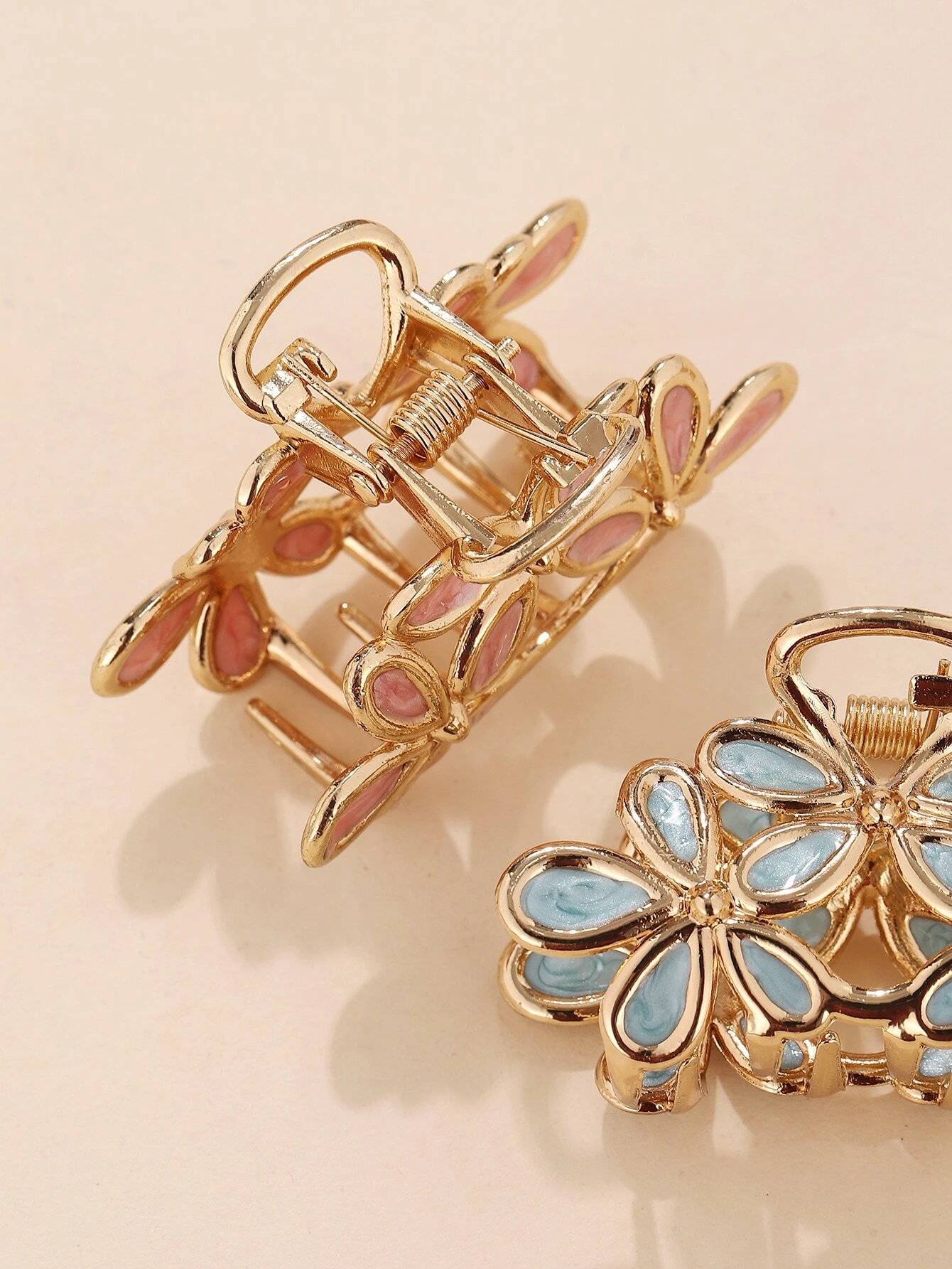 A set of three hair claws with flower designs, providing a stylish and functional way to secure your hair in place.