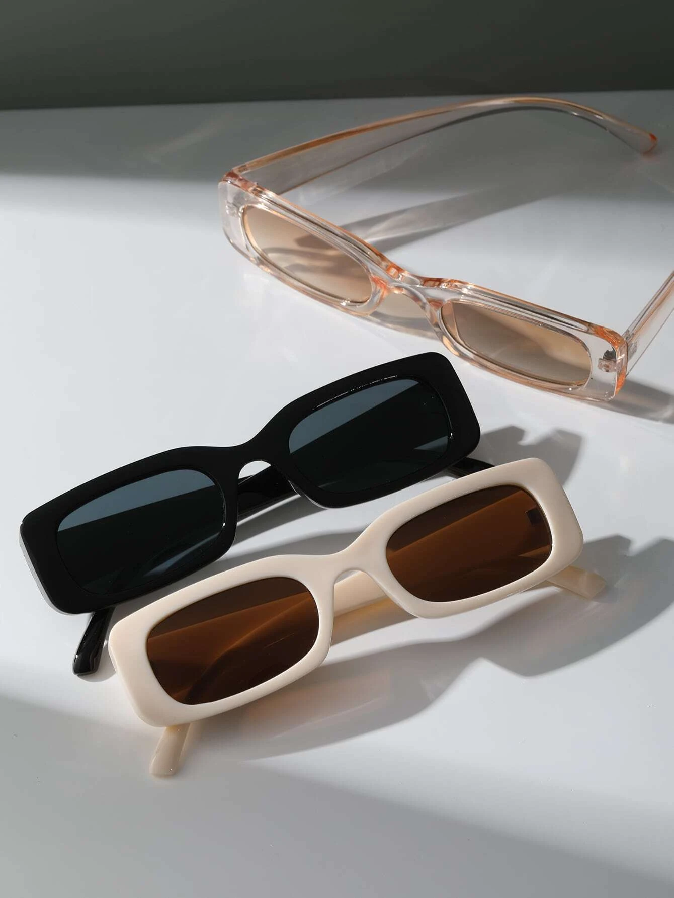 Three pairs of Square Frame Sunglasses featuring different color combinations. Square frames add a touch of boldness to your accessory collection while providing essential sun protection.
