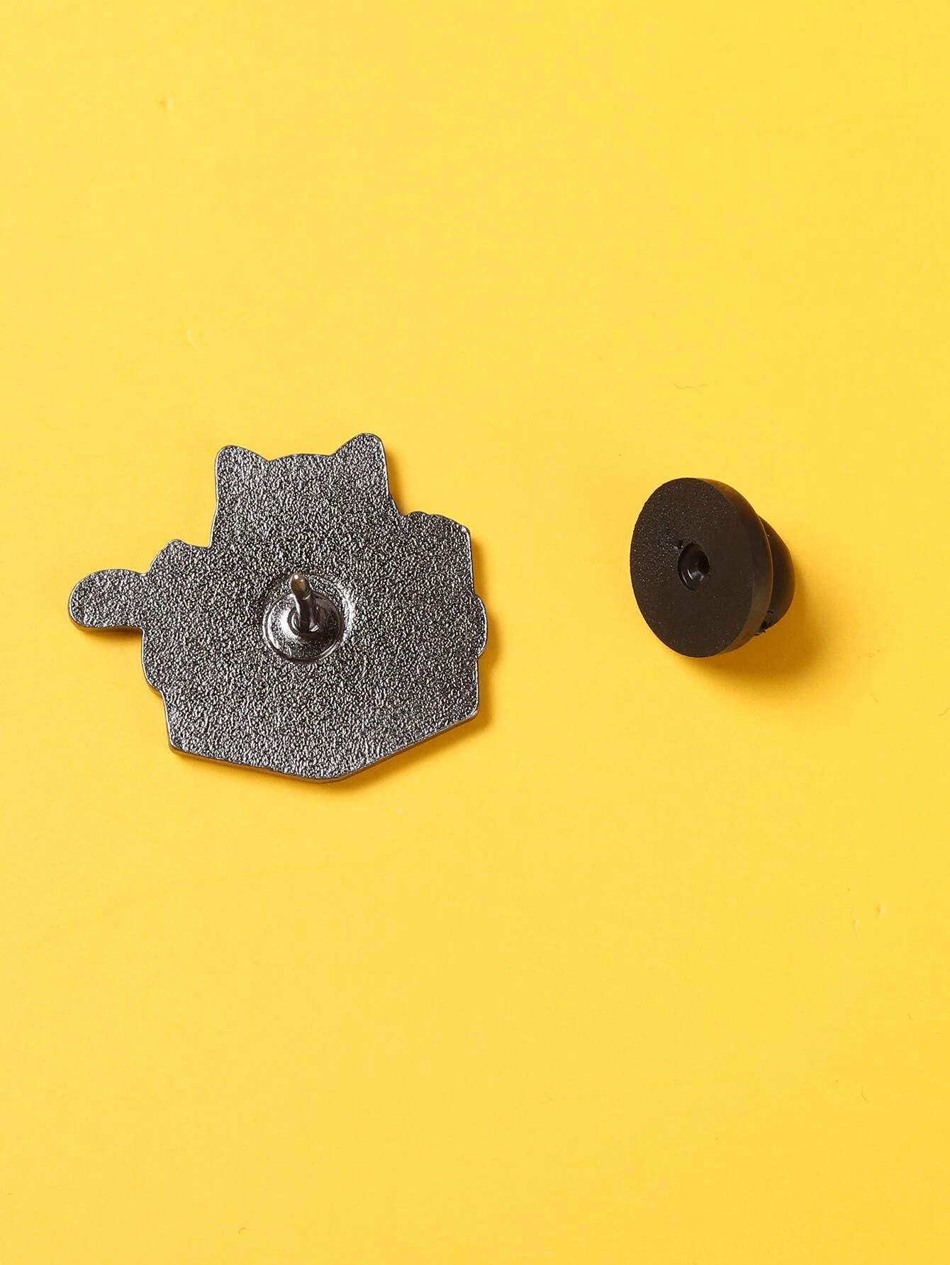 A brooch designed in the shape of a book, adding a literary and intellectual touch to your attire or accessories.