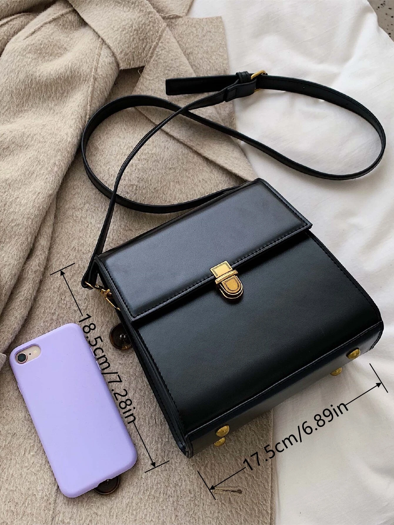 Mini square bag with minimalist design and snap button detail flap. This accessory combines simple elegance with functional embellishments, offering a chic and versatile way to carry your essentials.