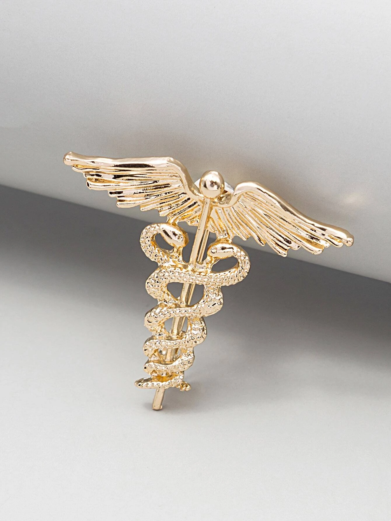 Single creative brooch, showcasing a unique and artistic design for a standout and expressive accessory.