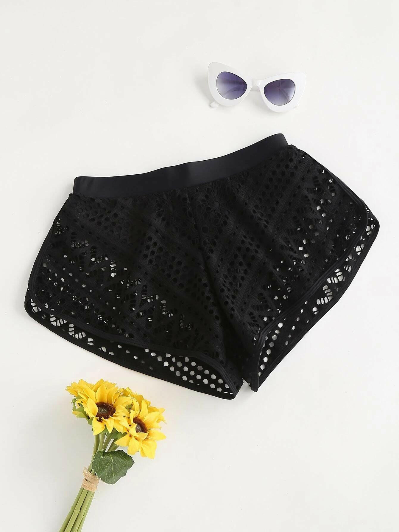 Black bikini shorts with stylish hollow-out detailing. These shorts showcase a chic and edgy design, featuring intricate hollow-out patterns against a black backdrop. The cut and style provide a comfortable and flattering fit, making them a trendy choice for swimwear. The hollow-out elements add a touch of flair to the classic black bikini shorts, perfect for a bold and fashionable beach or poolside statement.