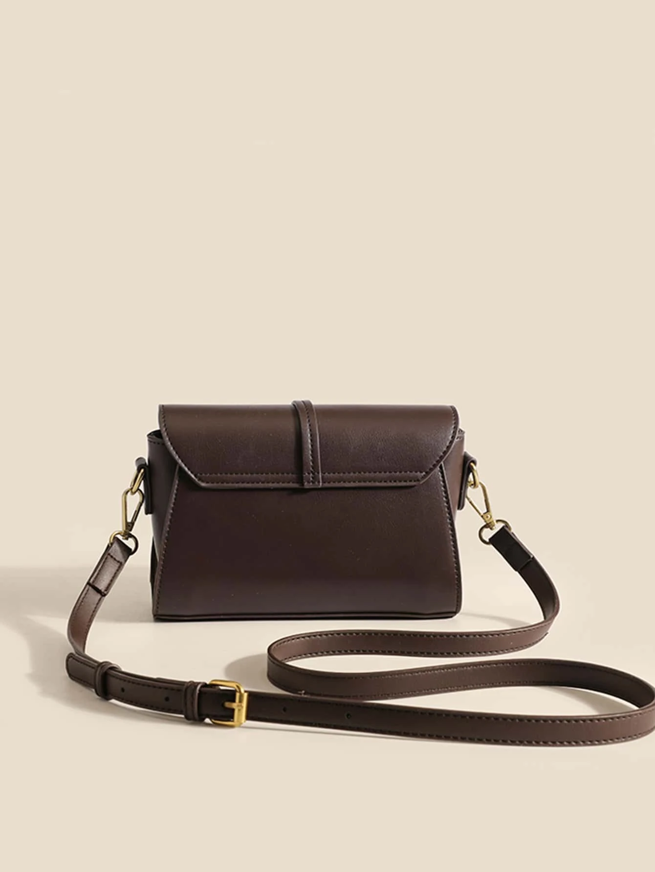 Mini square bag with houndstooth pattern flap. This accessory combines classic design with modern elements, offering a chic and stylish way to carry your essentials.